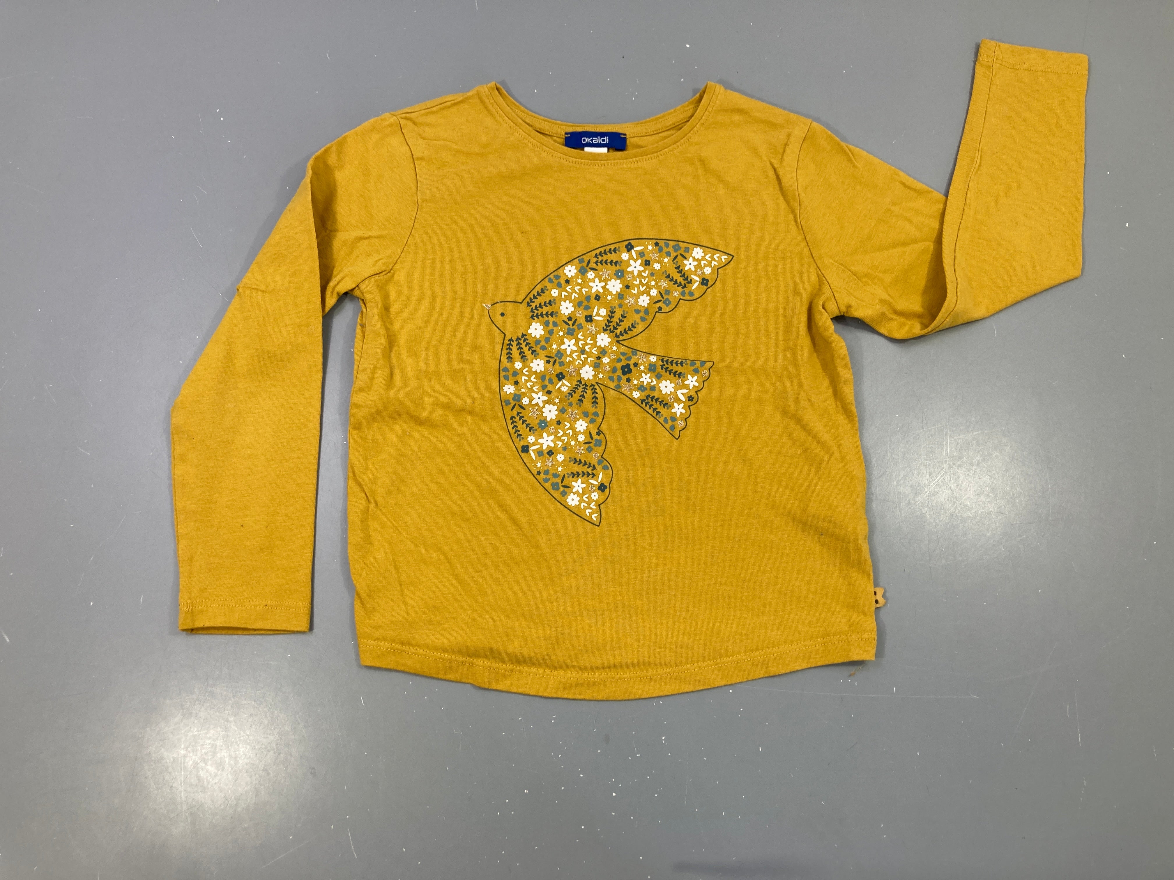 T-shirt m.l moutarde oiseau fleuri, légèrement bouloché