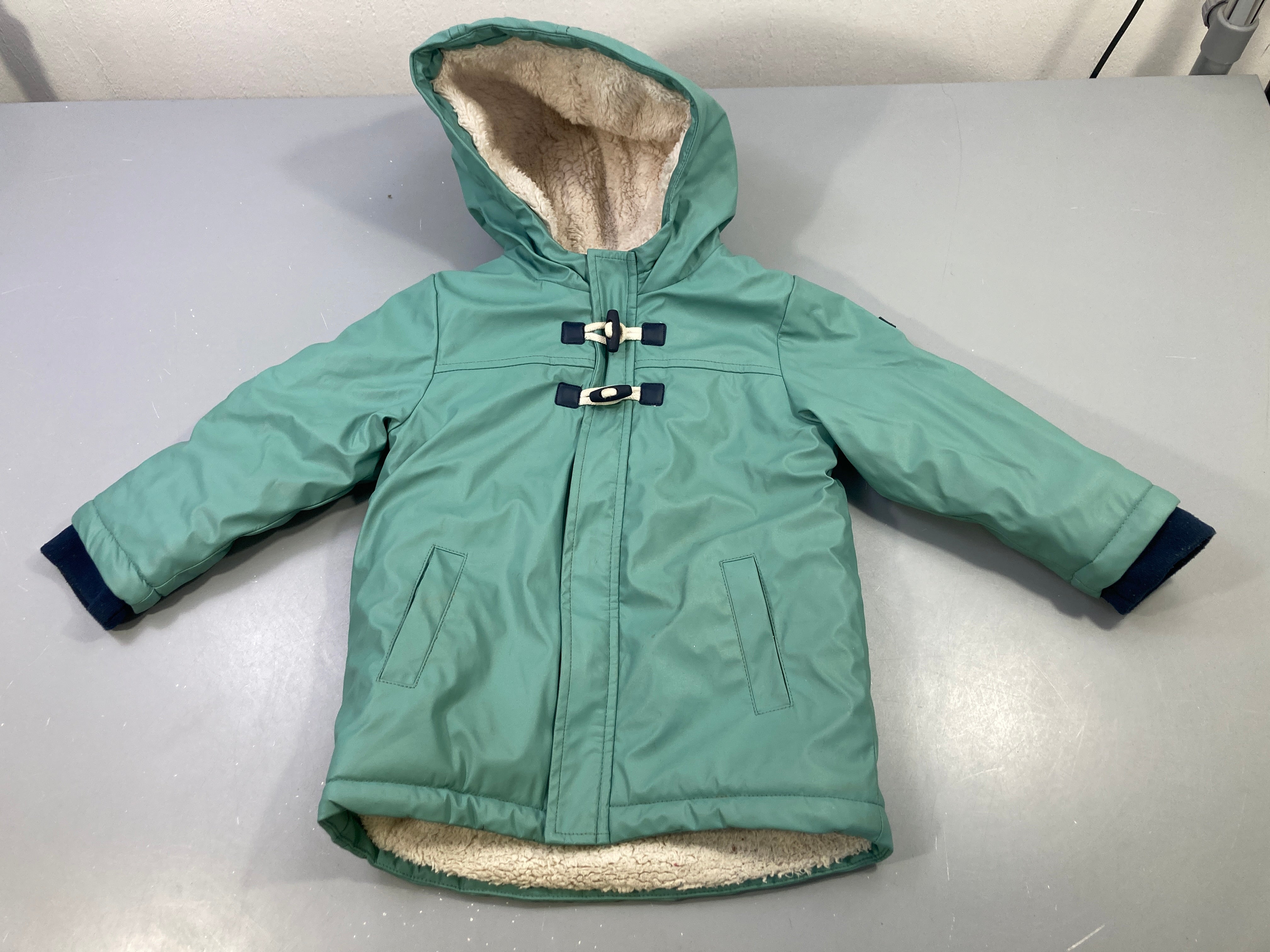 Veste cirée verte capuche doublé fourrure synthétique