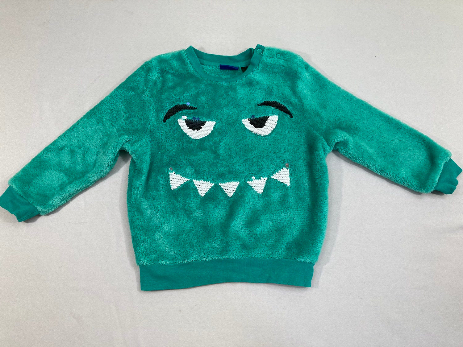 Pull velours vert monstres sequins