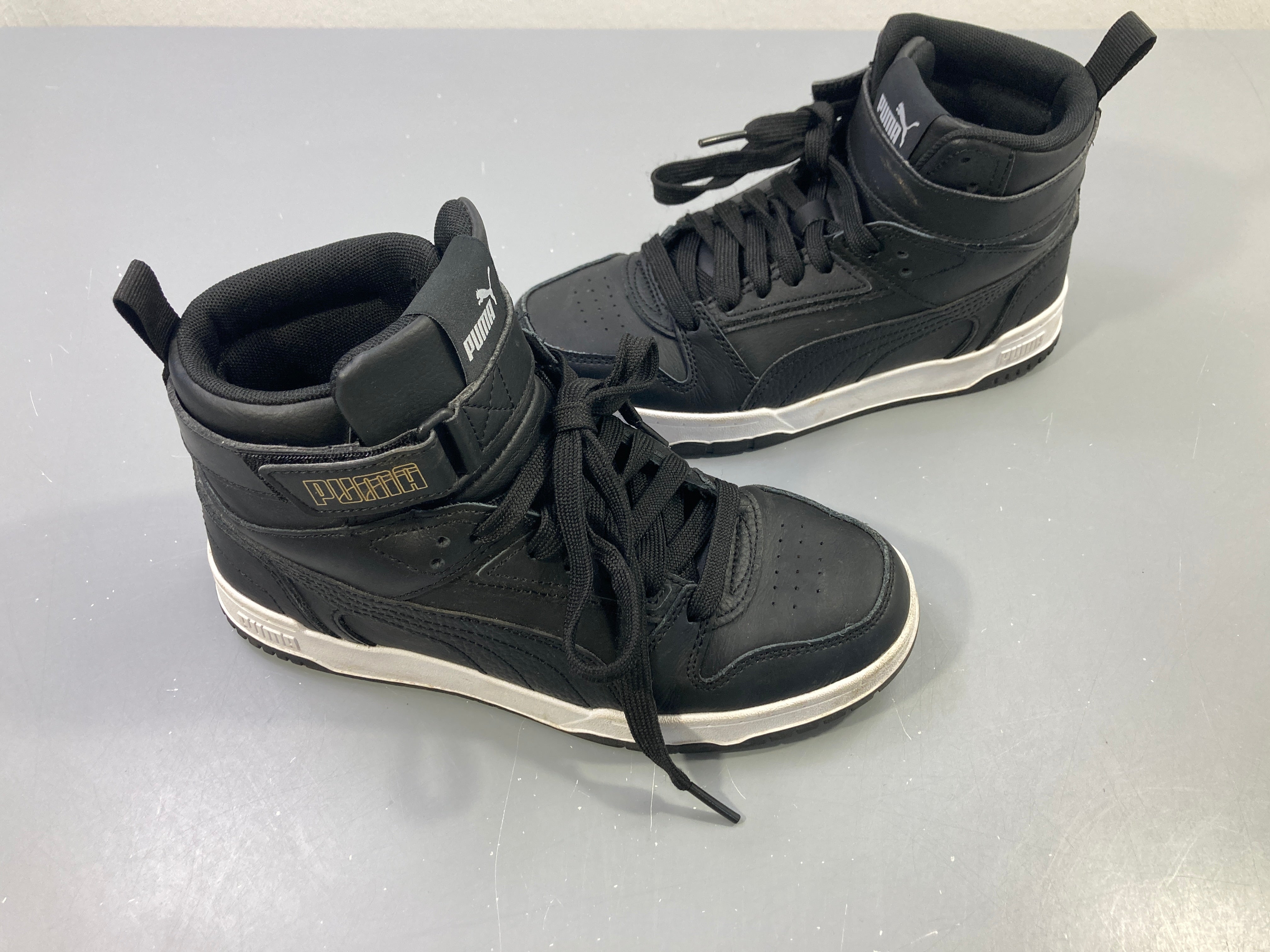 Baskets montantes noires cuir, semelle blanche 37