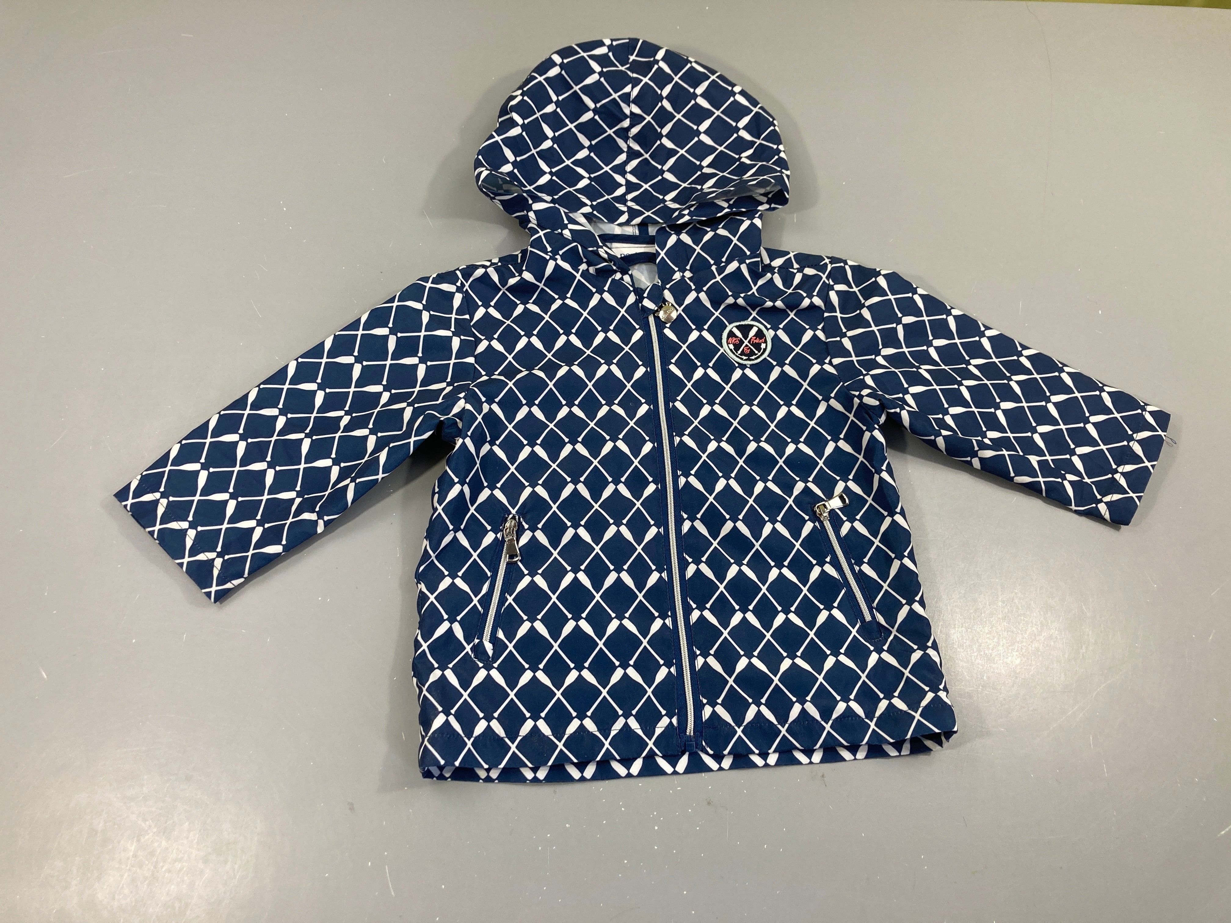 Veste coupe vent bleu foncé pagaies en croix