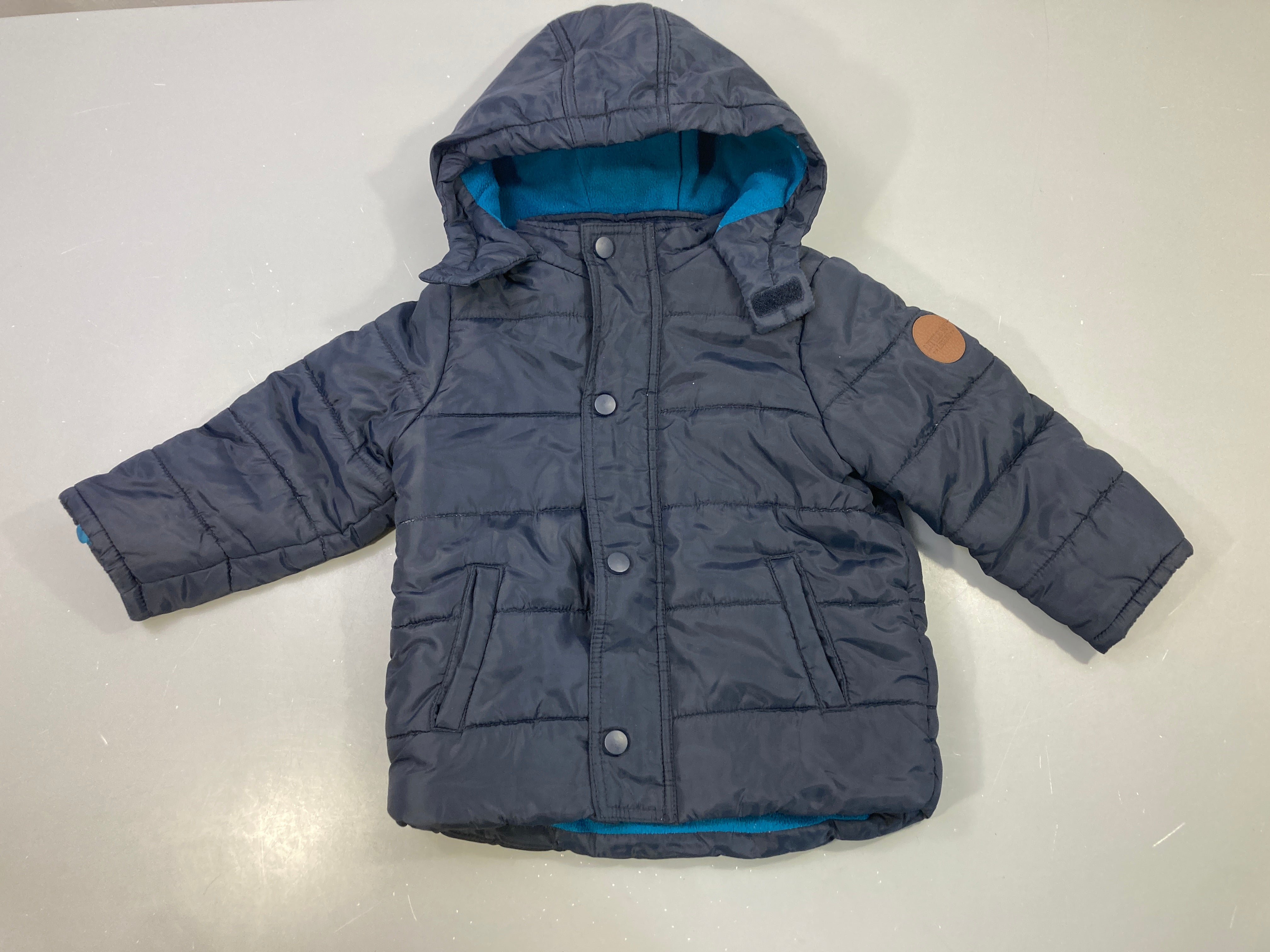 Veste polaire bleu marine capuche bleue zippée