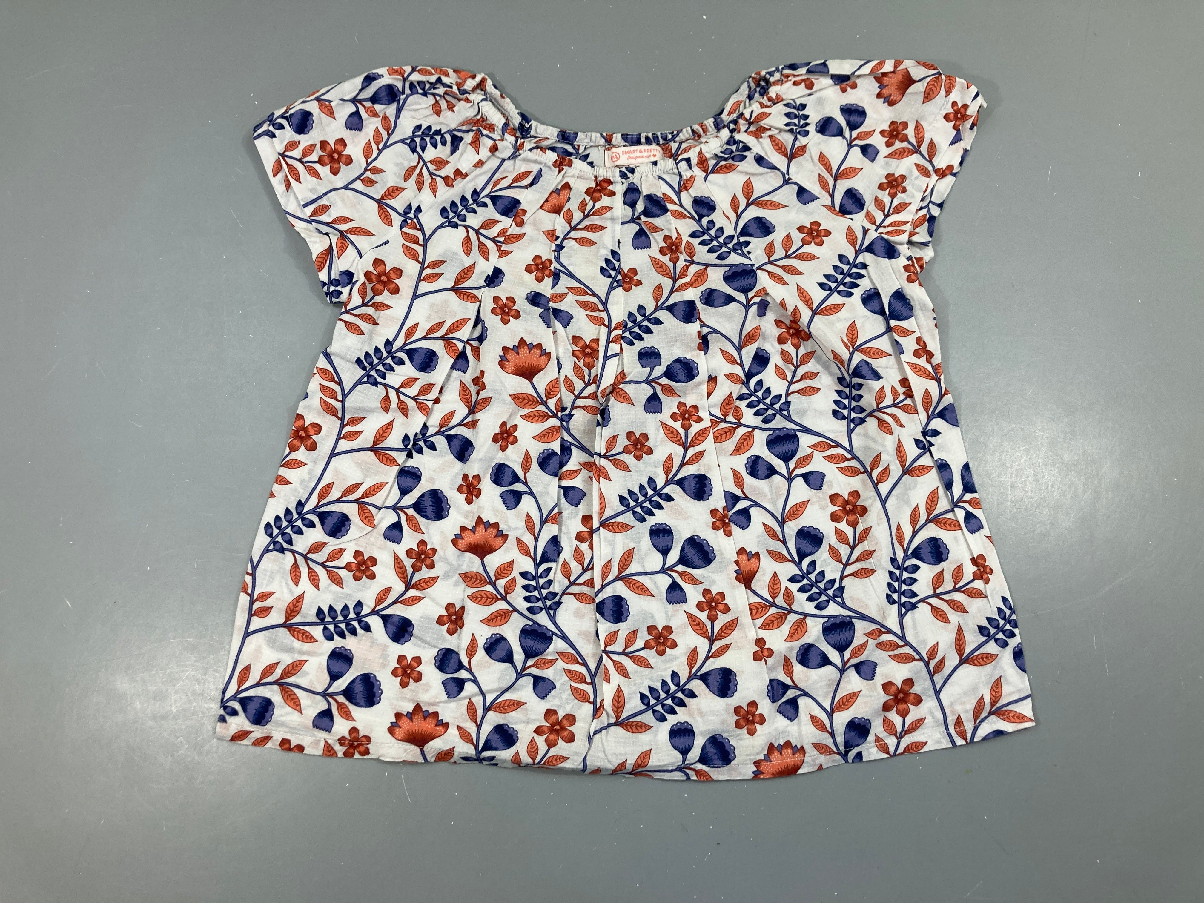 Blouse blanche feuillage bleu-ocre