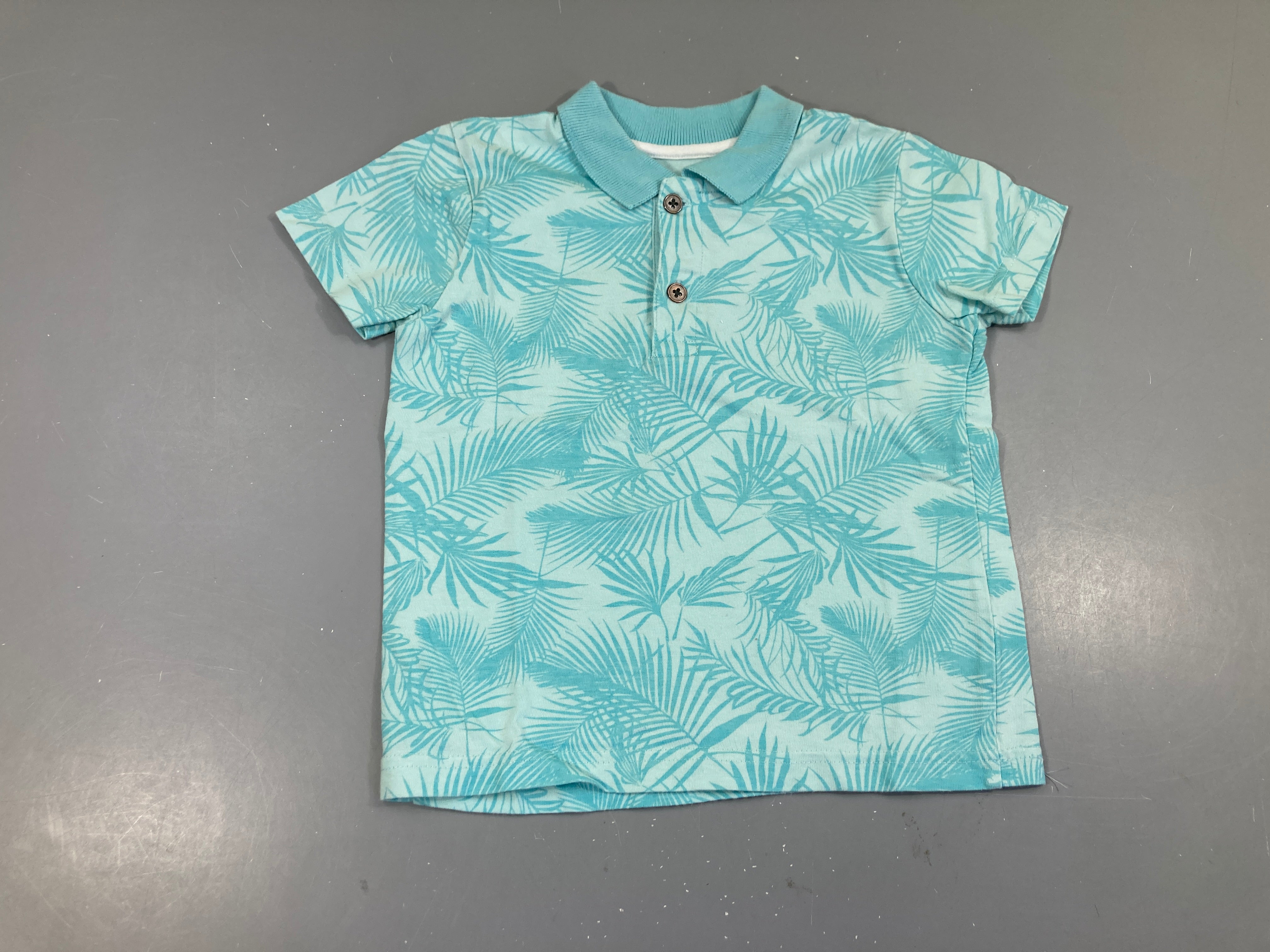 Polo m.c turquoise feuillage