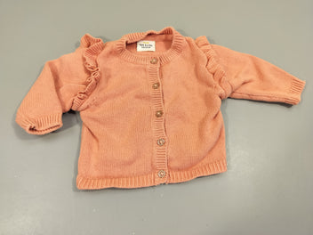 Gilet rose , boutons pailletés. Froufrous manches