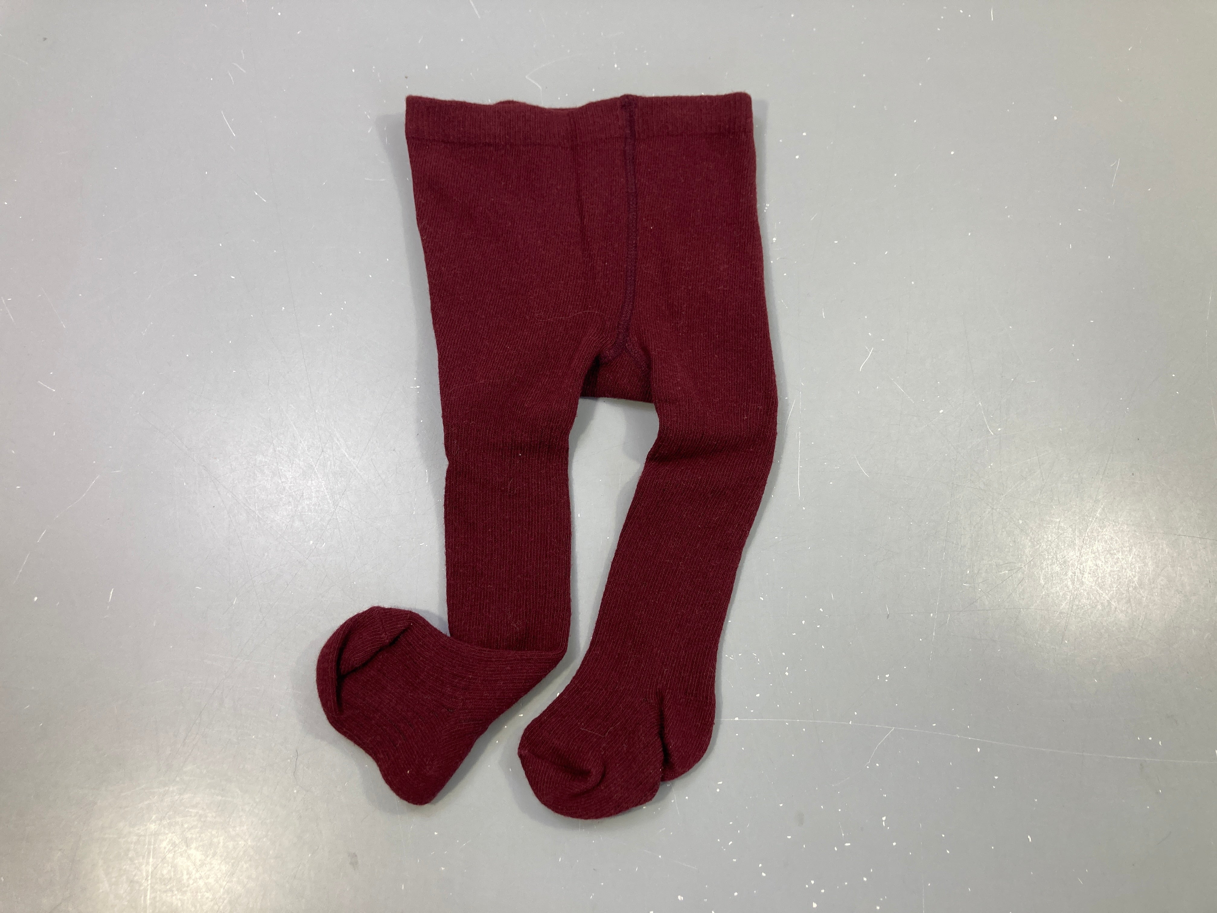 Collants bordeaux , pas de taille indiquée, estimée 3-6m