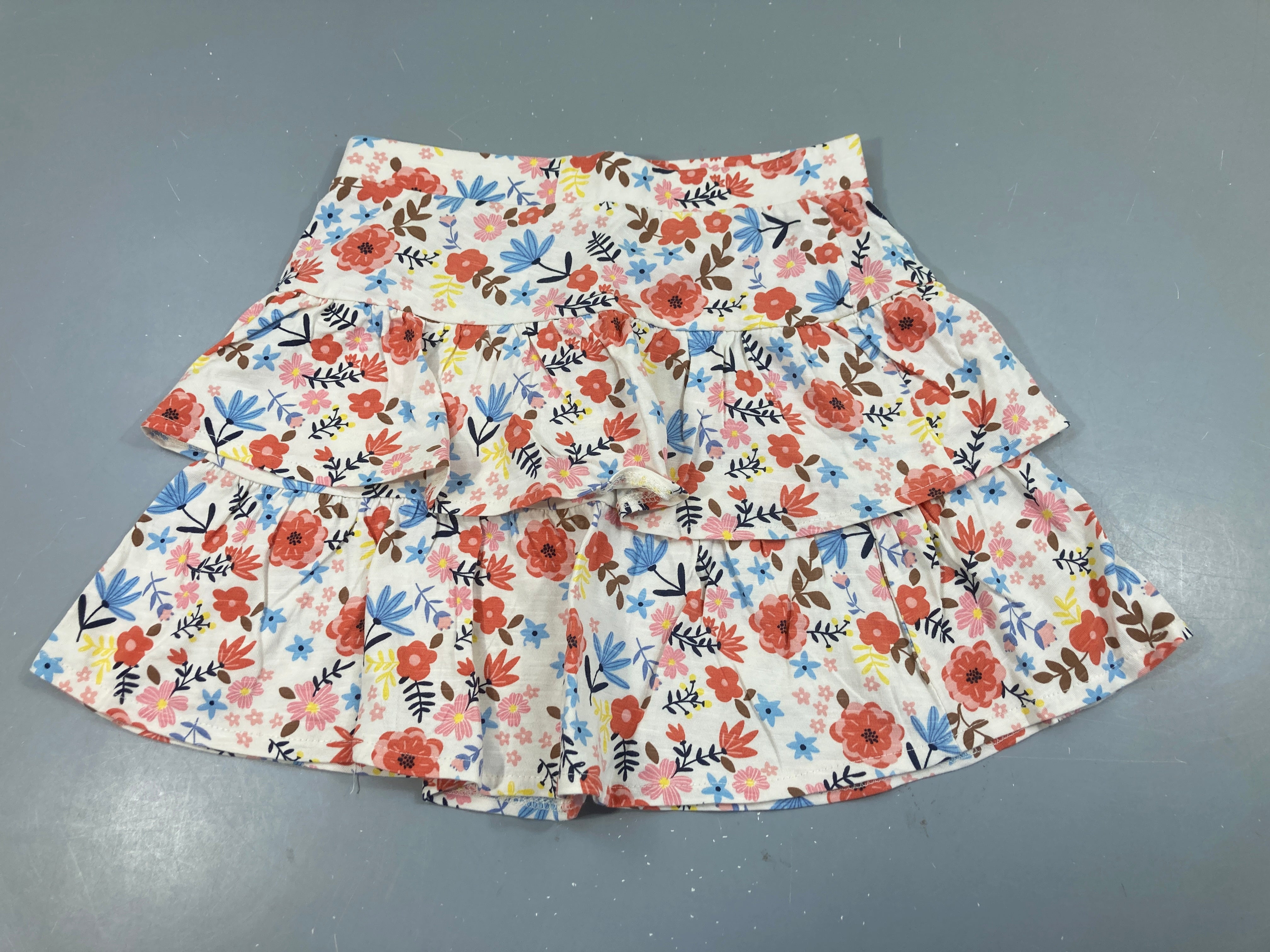 Jupe jersey écru fleuri à volants