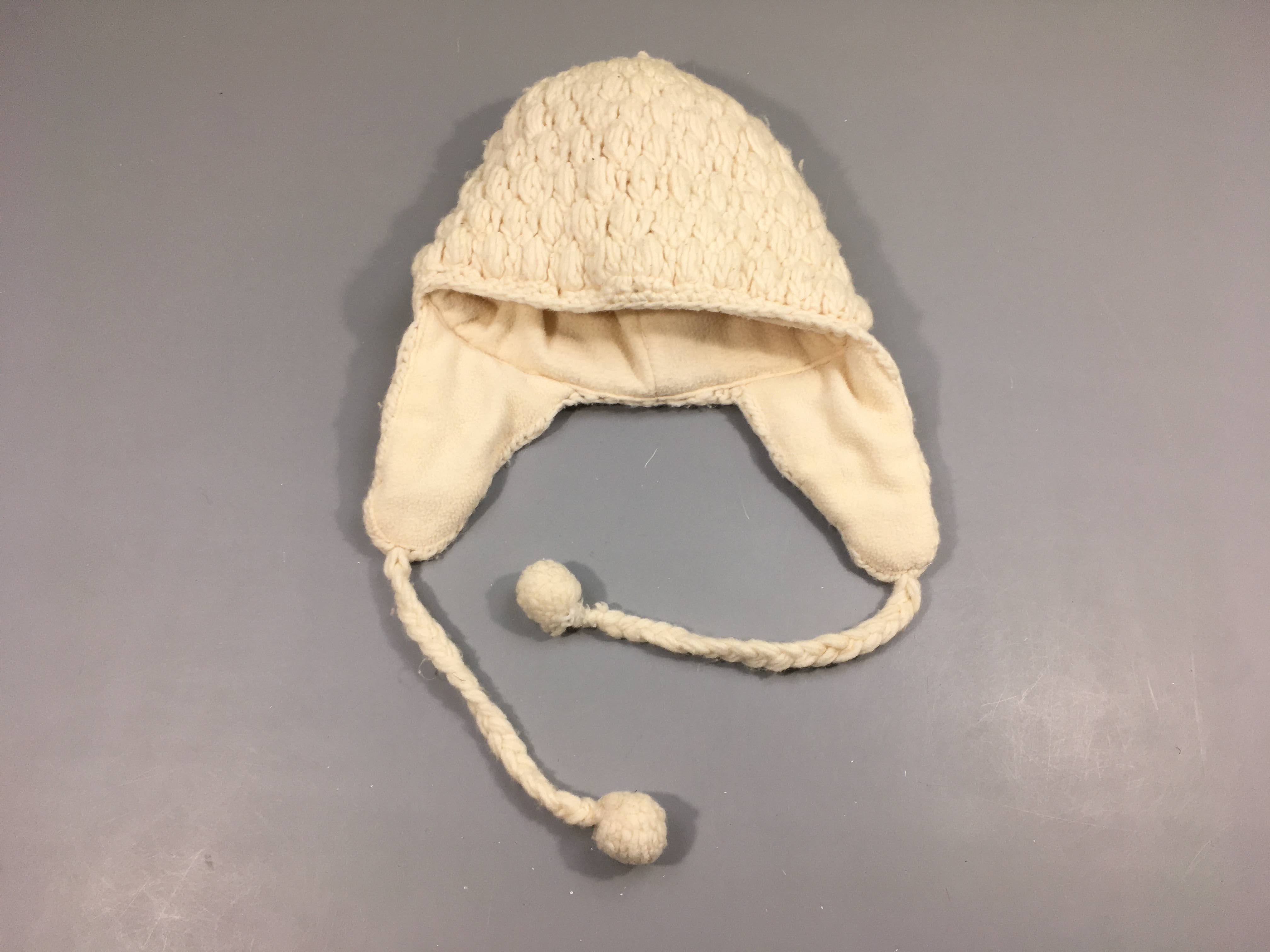 Bonnet mailles écru doublé polar pompom