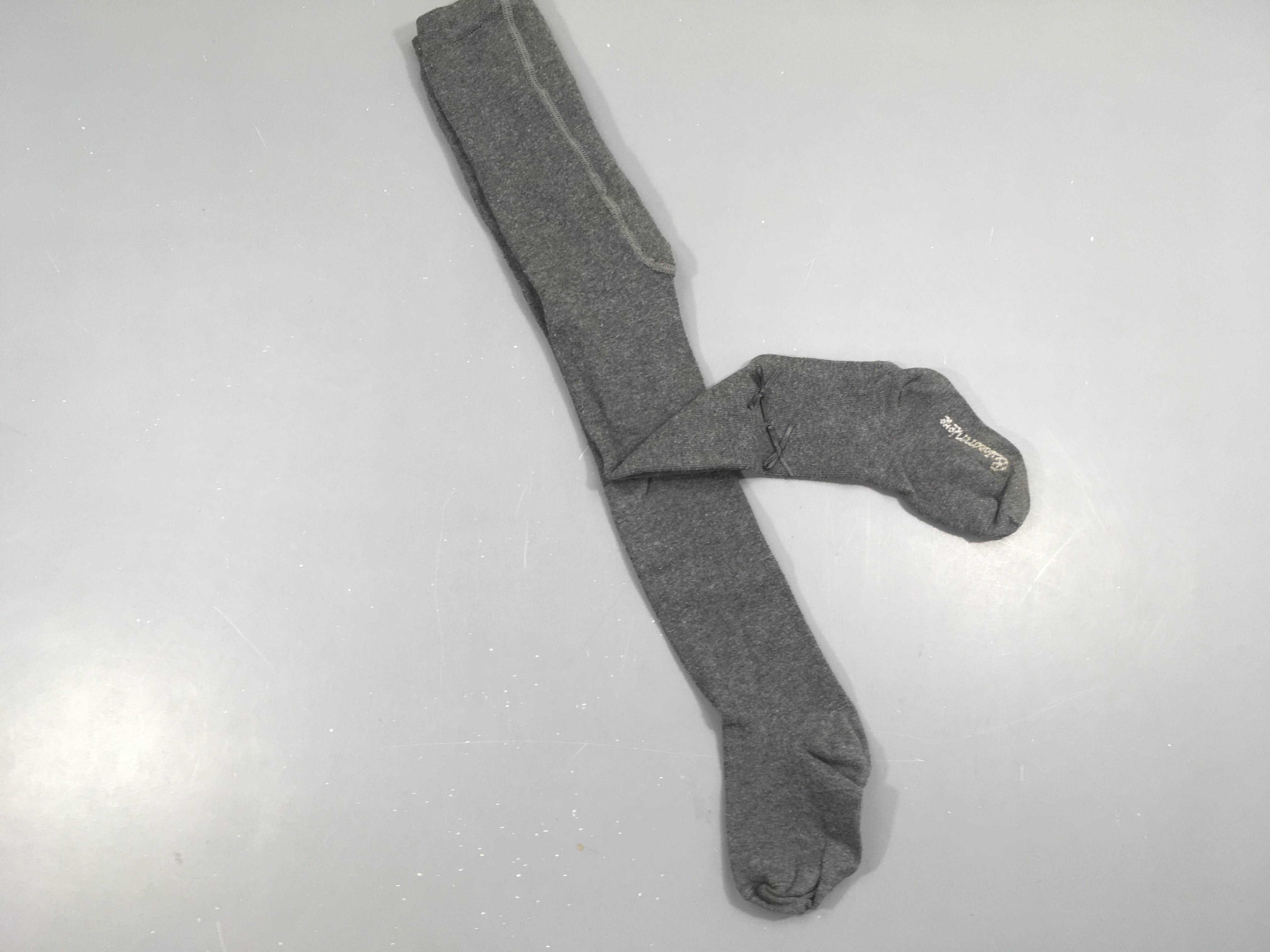 Collants gris  noeuds Légèrement boulochés