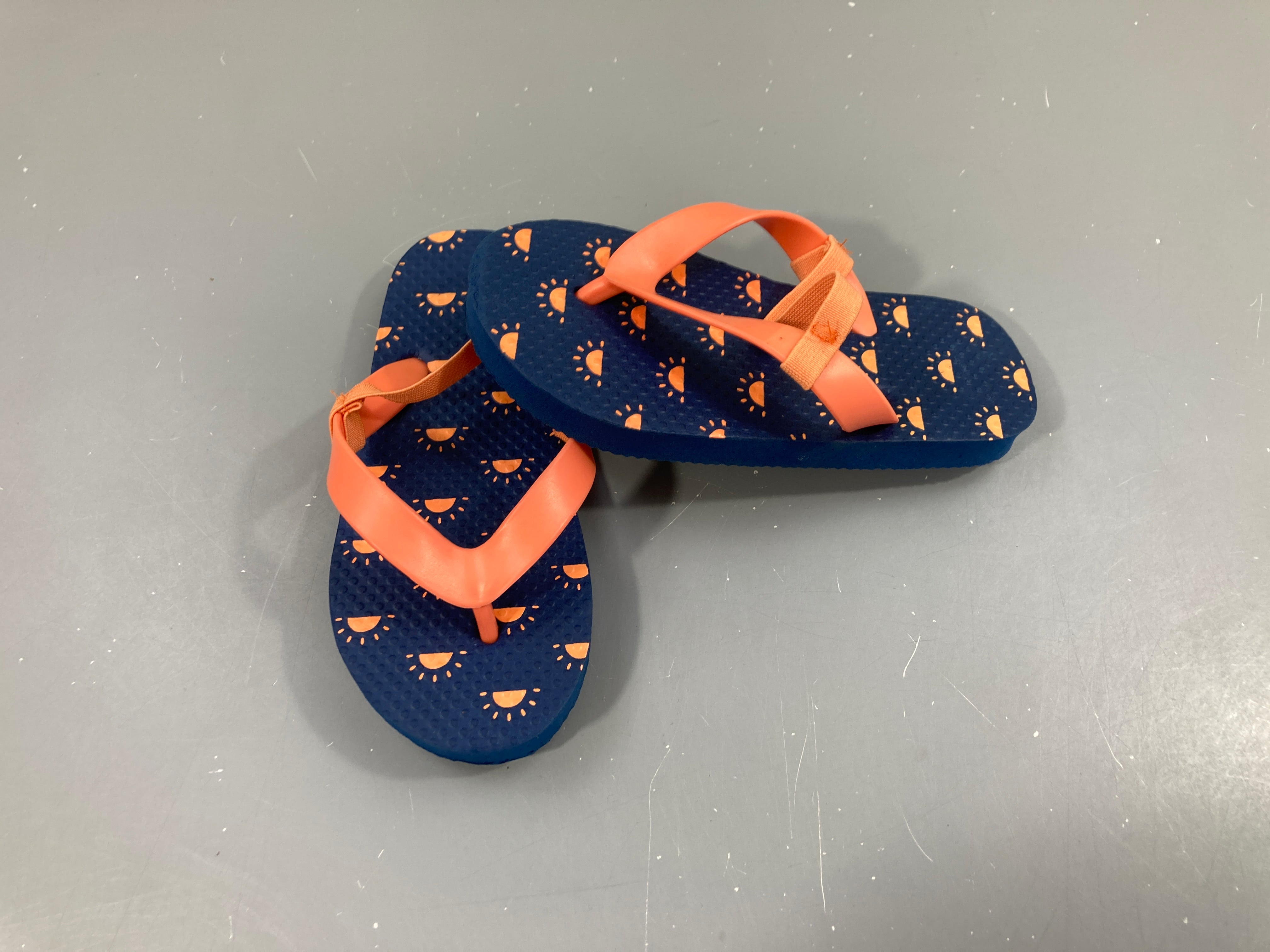 Tongs bleues soleil corail
