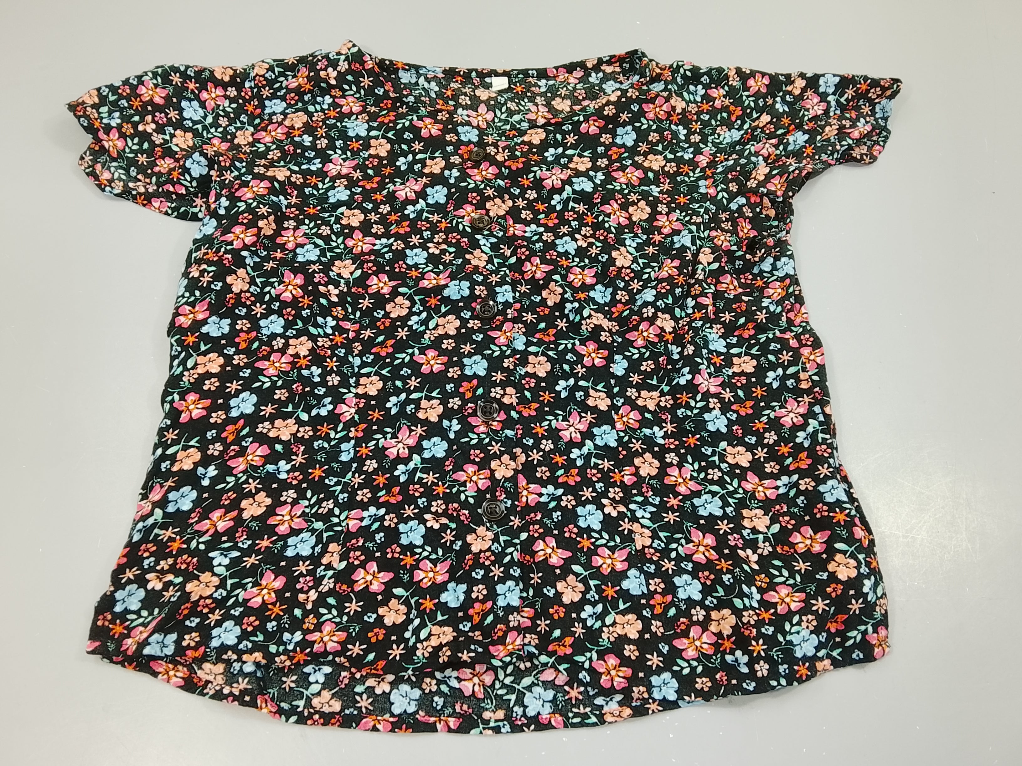 Blouse m.c noire à fleurs colorées