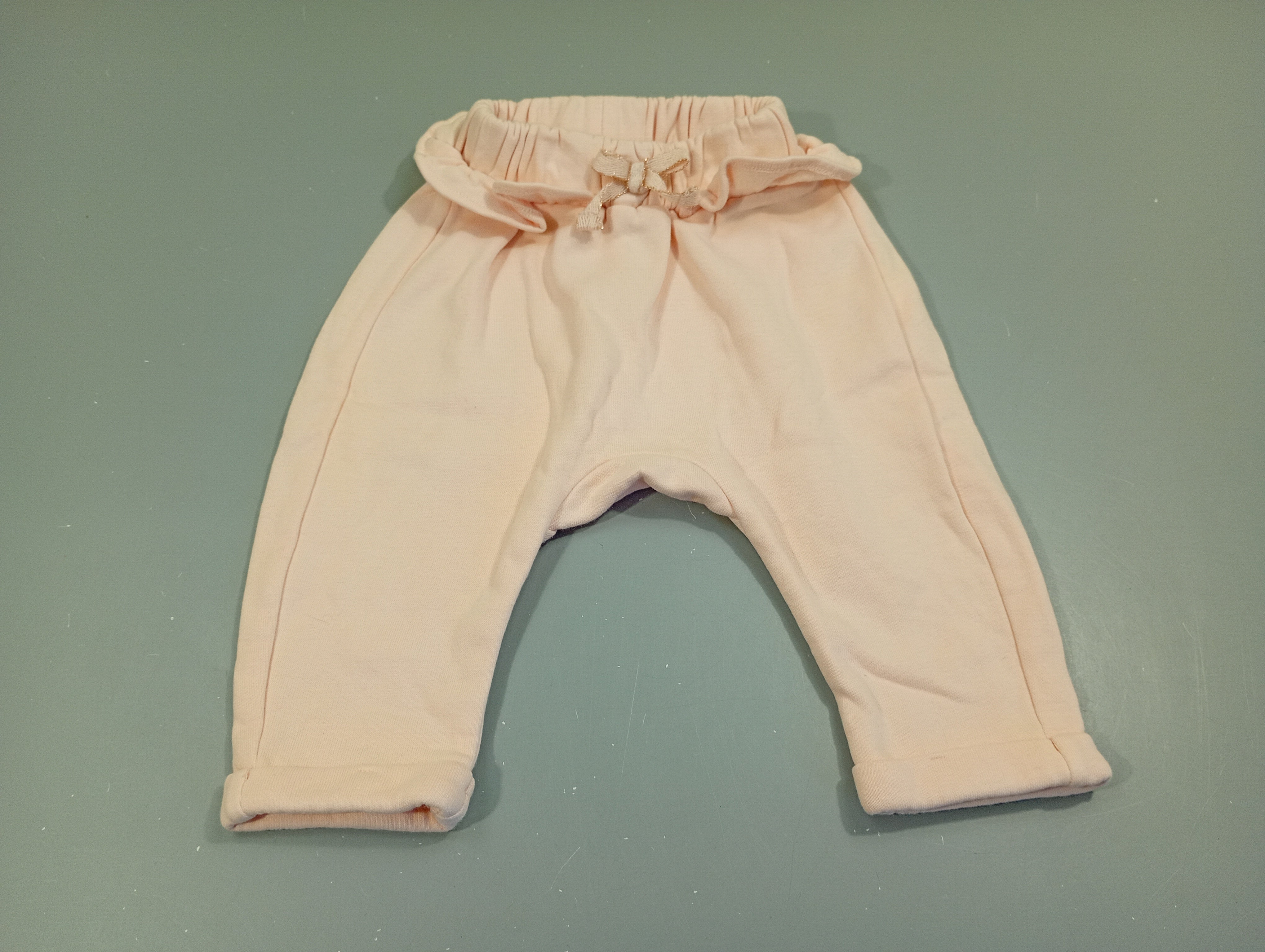 Pantalon jogging rose clair, volant à la taille, petit noeud, intérieur polar.