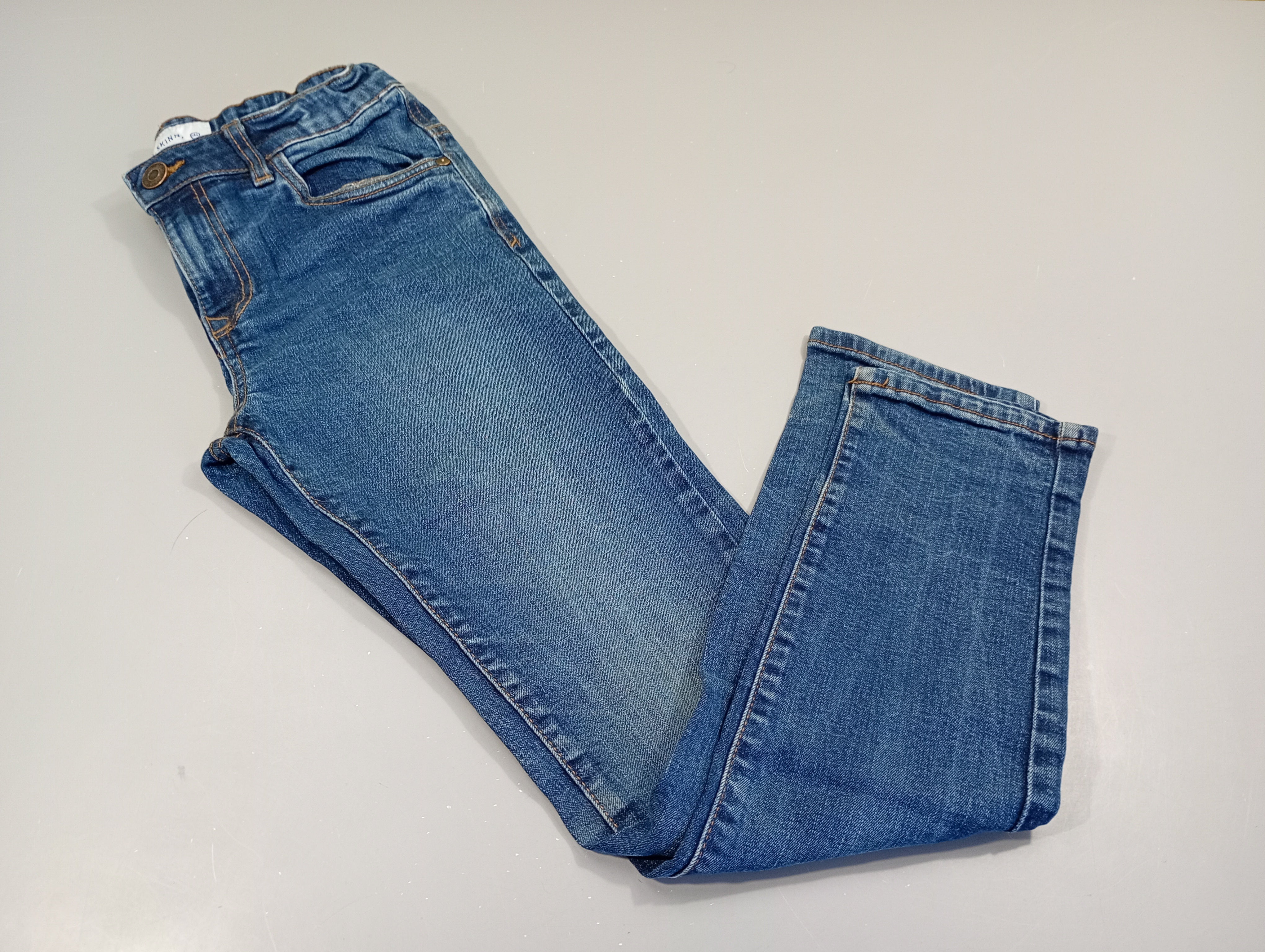 Jeans skinny, bouton cuivré