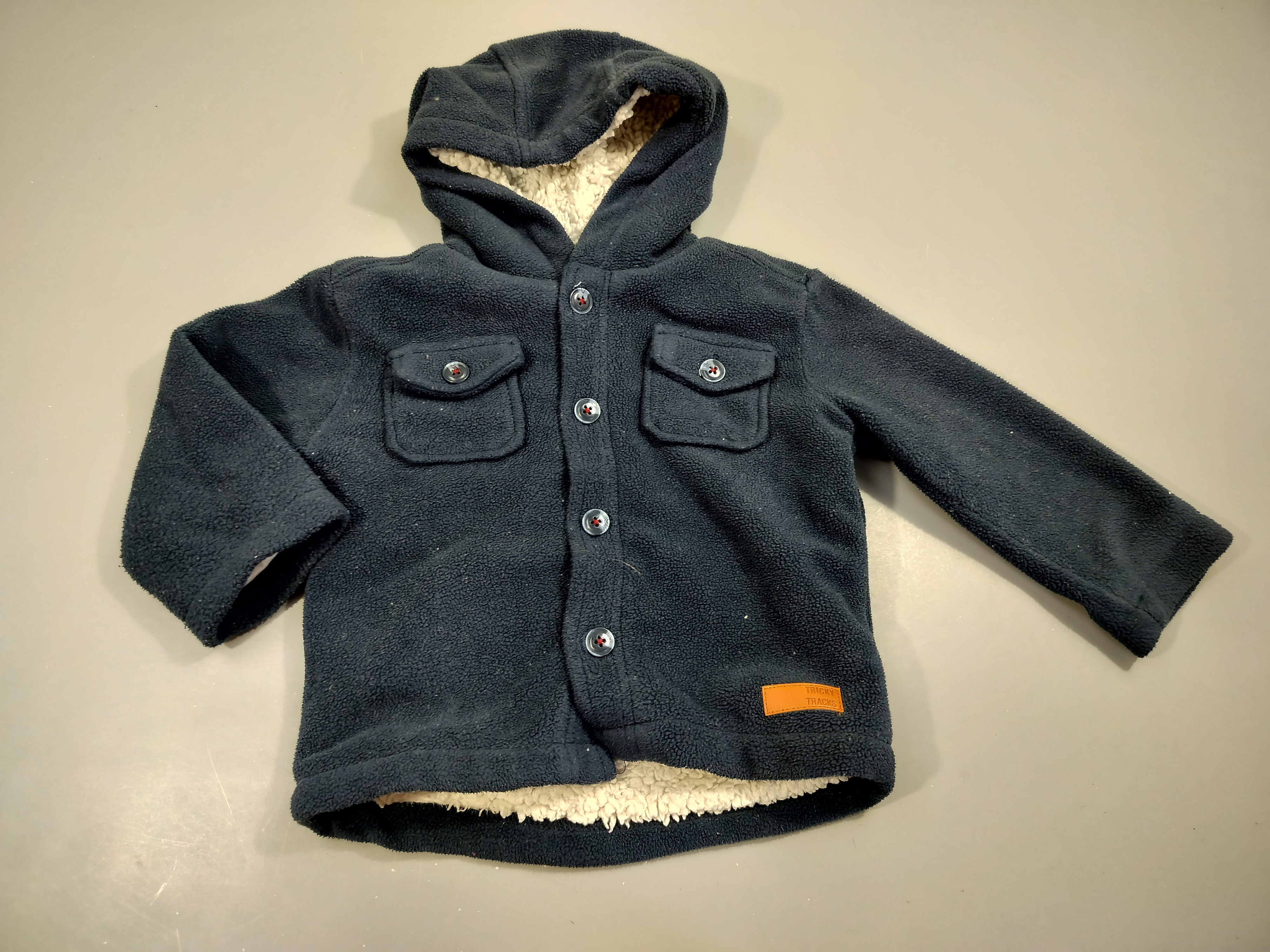 Veste bleu marine à capuche , intérieur moutonné. 100% polyester