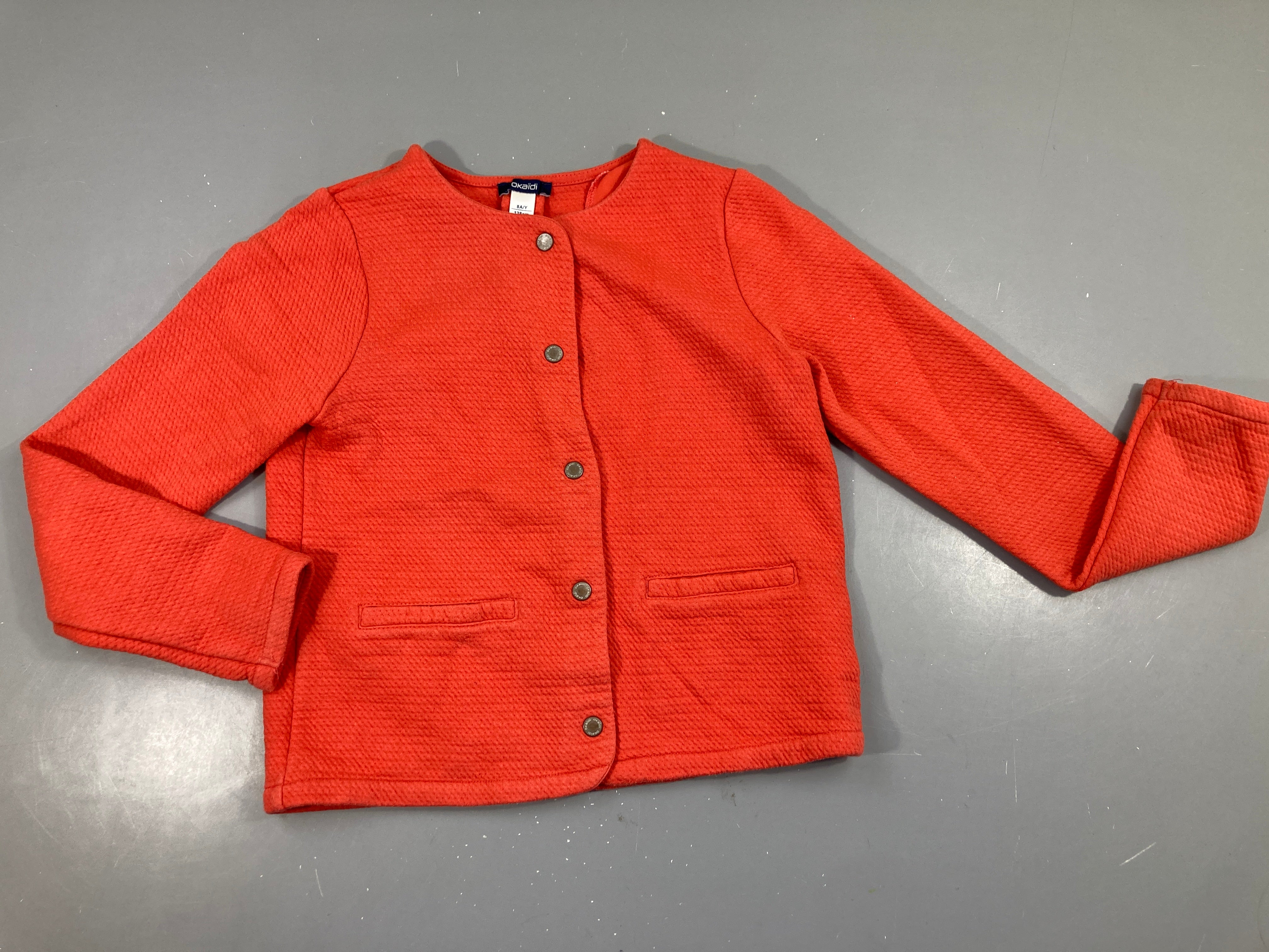 Gilet molleton texturé orange, très légèrement bouloché