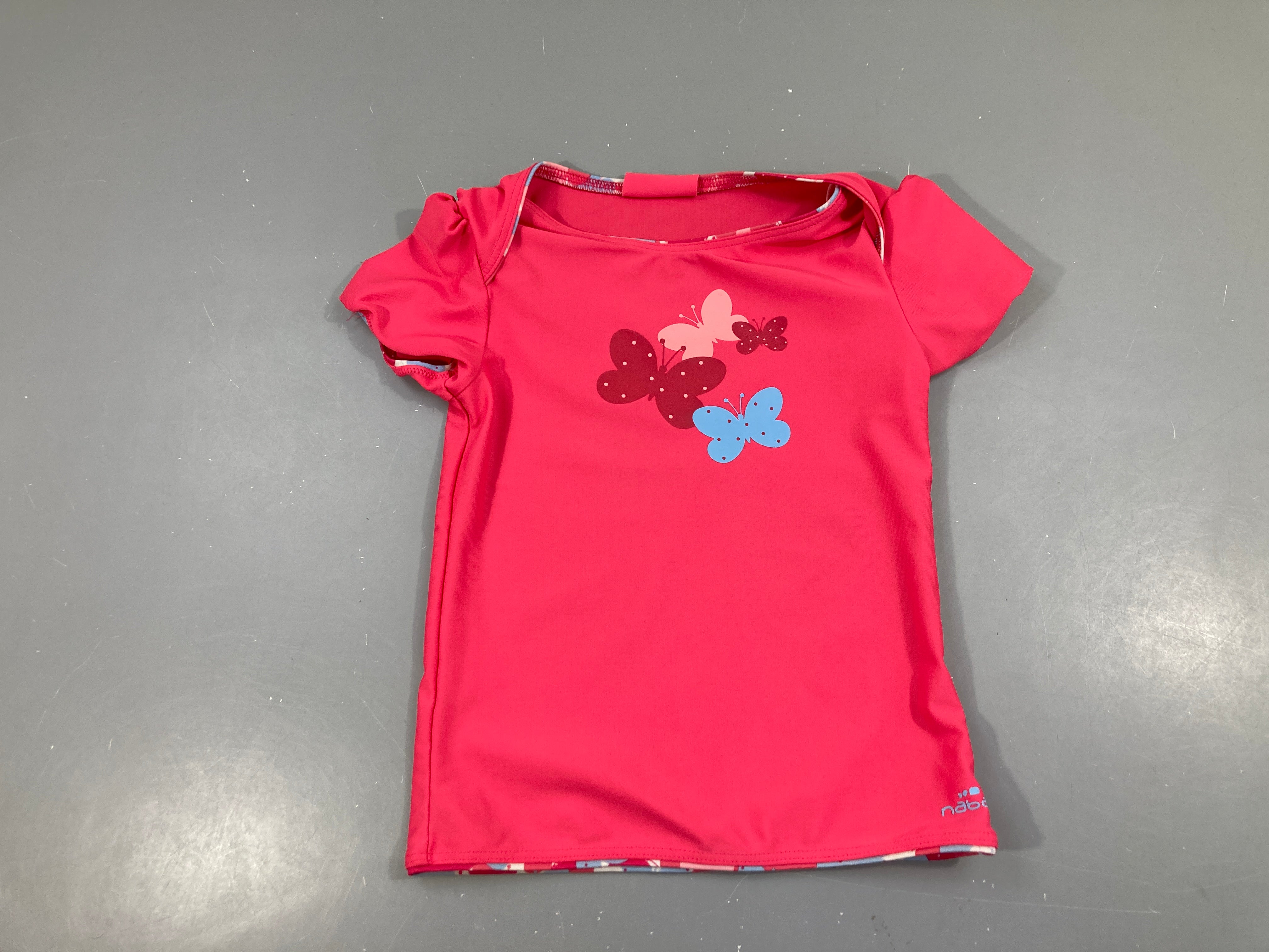 T-shirt m.c Anti-Uv rose Papillons Taille estimée Nabaiji