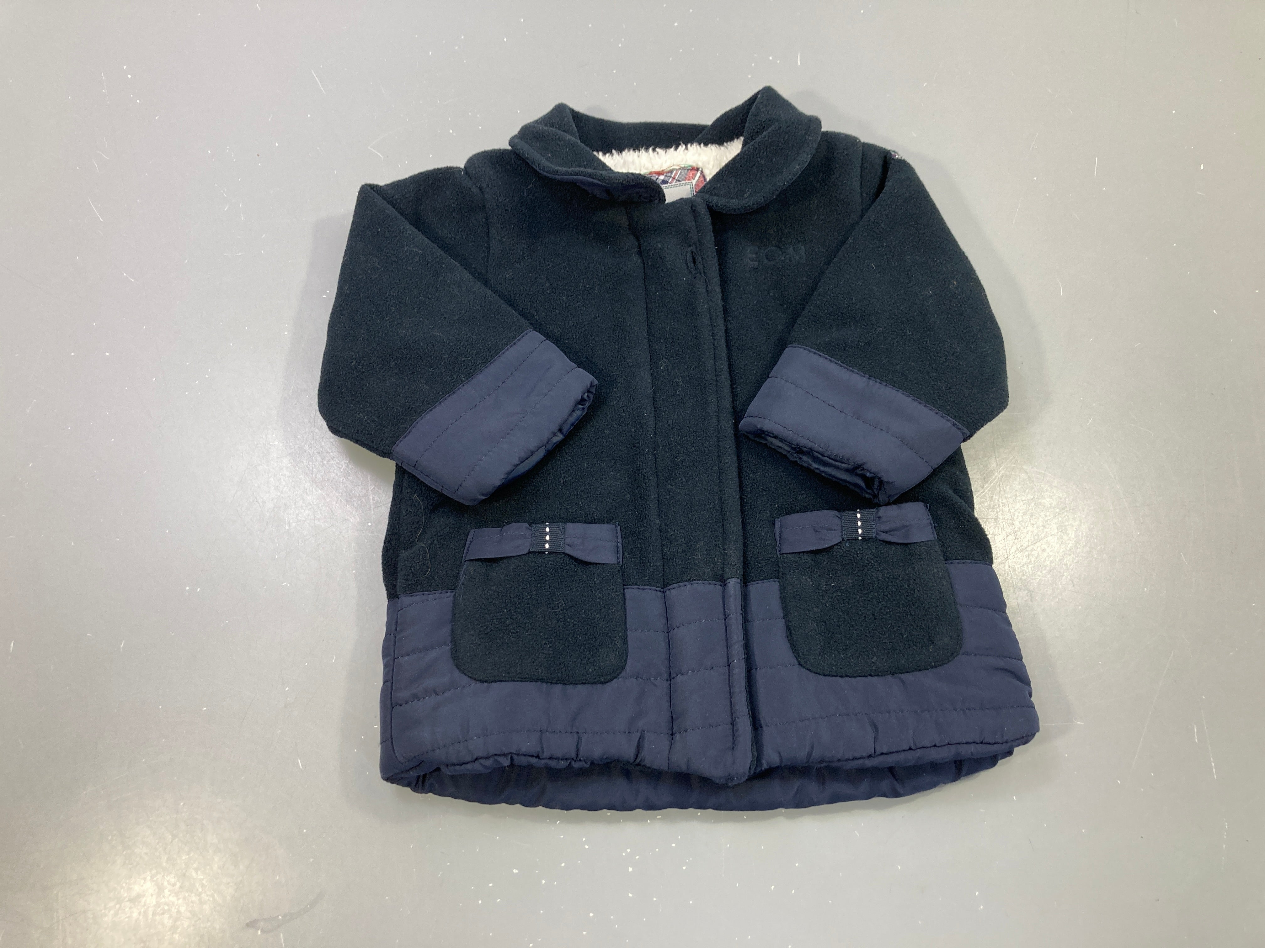 Manteau polaire bleu marine, doublure sherpa, poches nœuds