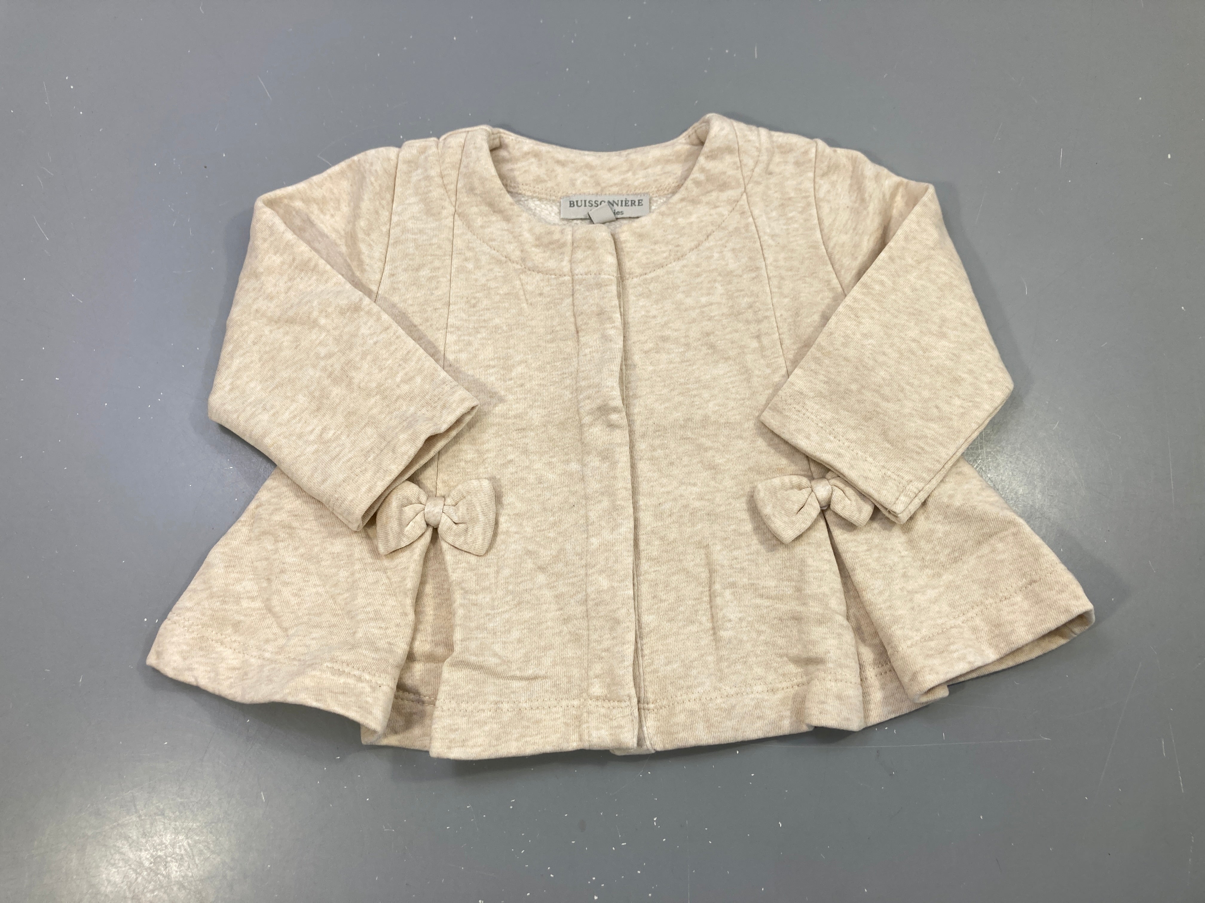 Gilet beige chiné molleton évasé, noeuds, pressions
