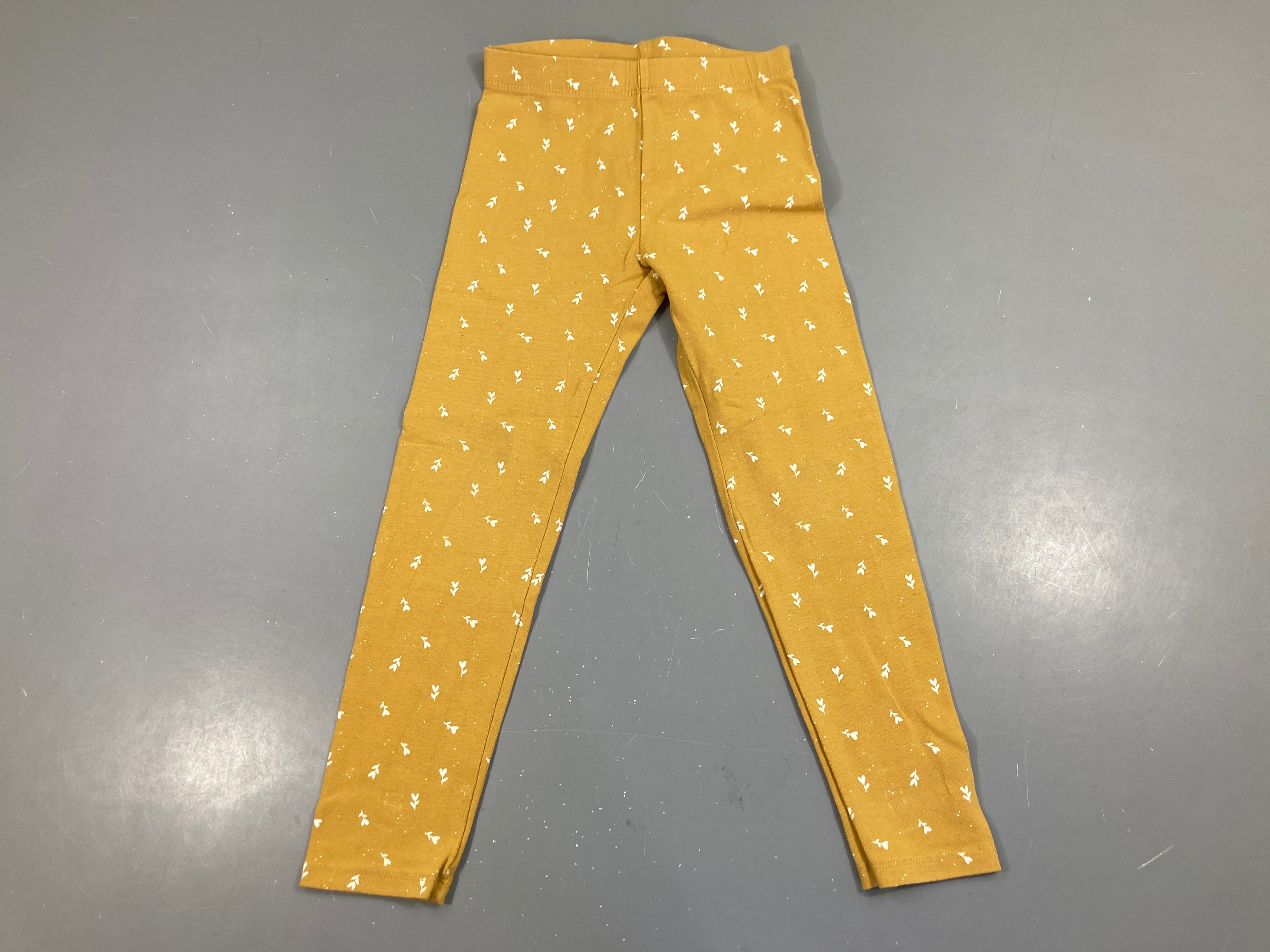 Legging jaune fleurs, légèrement bouloché