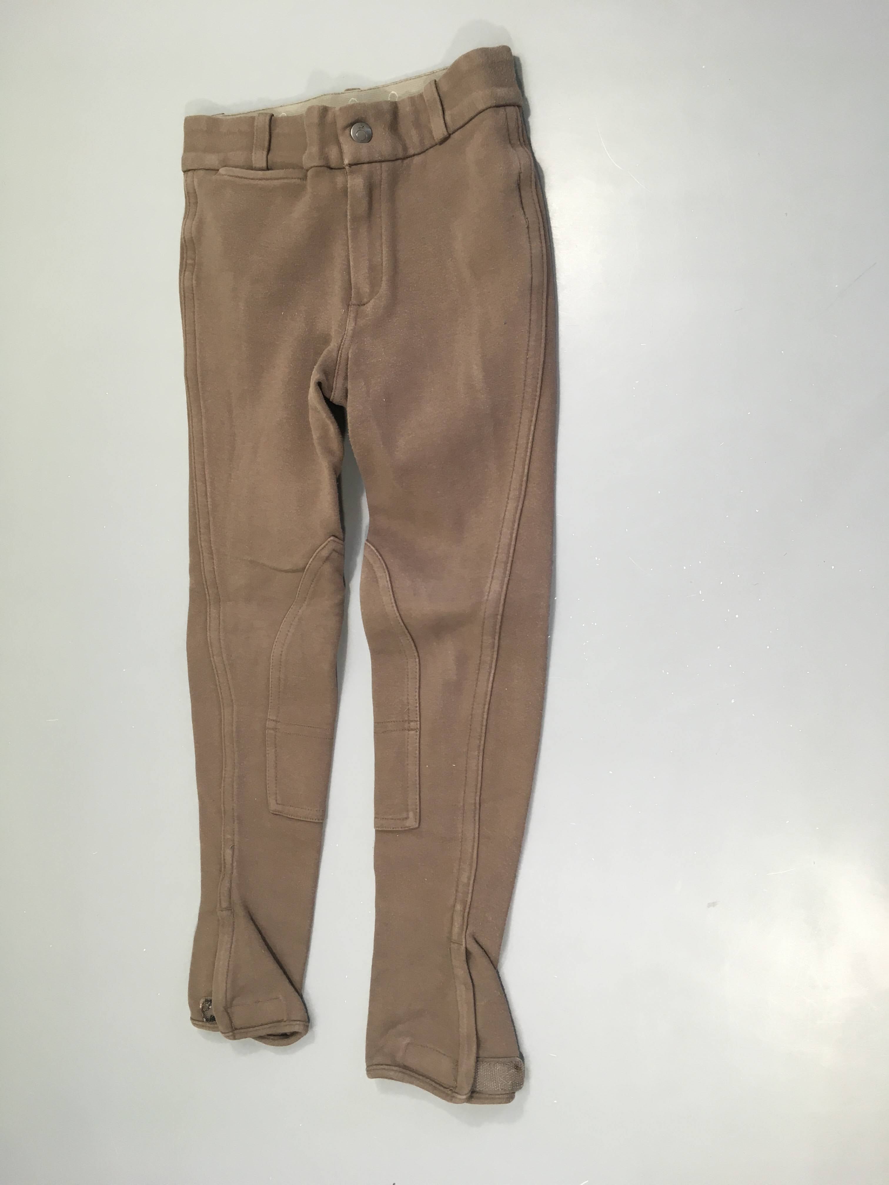 Pantalon d'équitation brun, légèrement bouloché