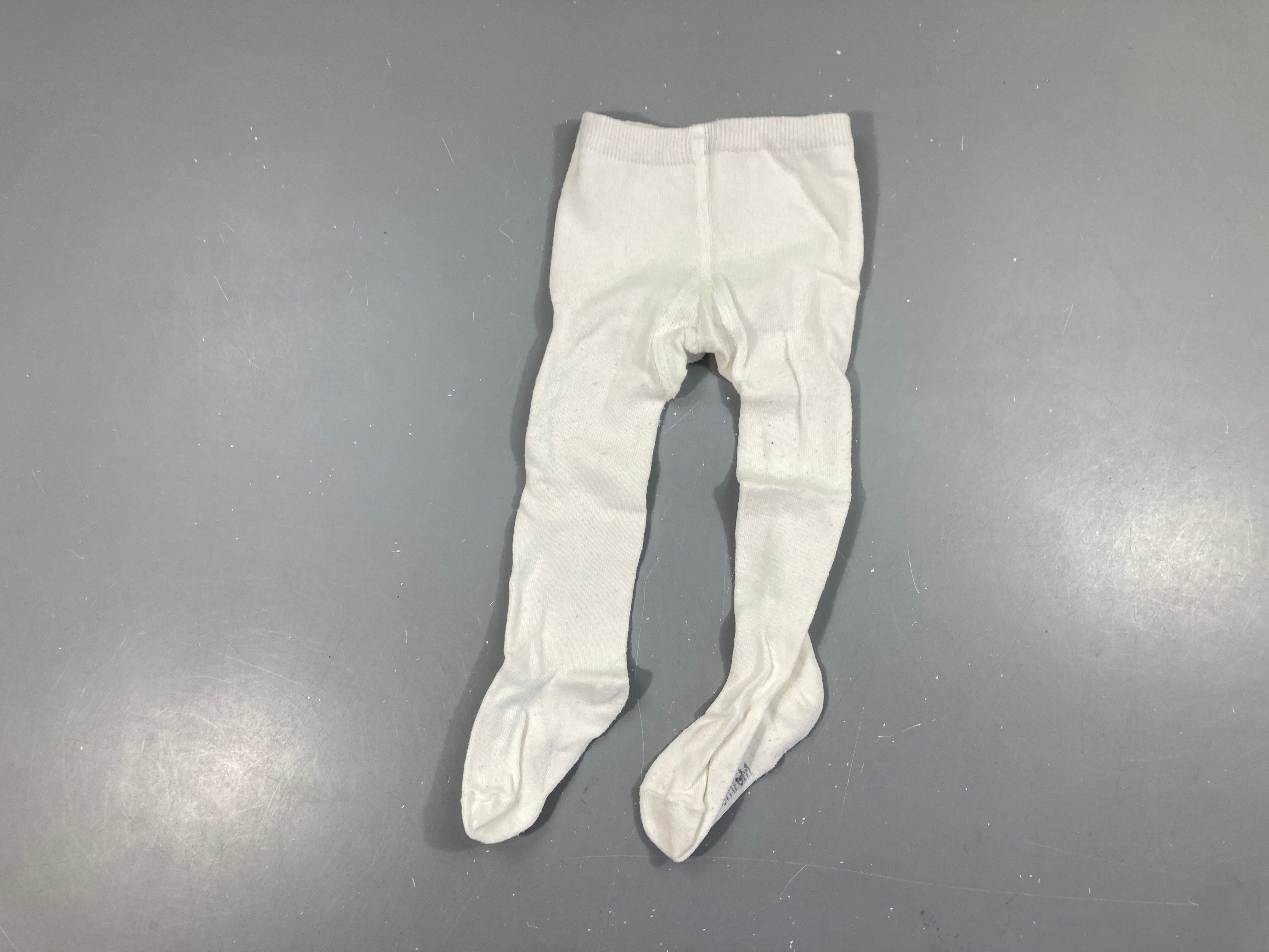 Collants blancs, légèrement bouloché