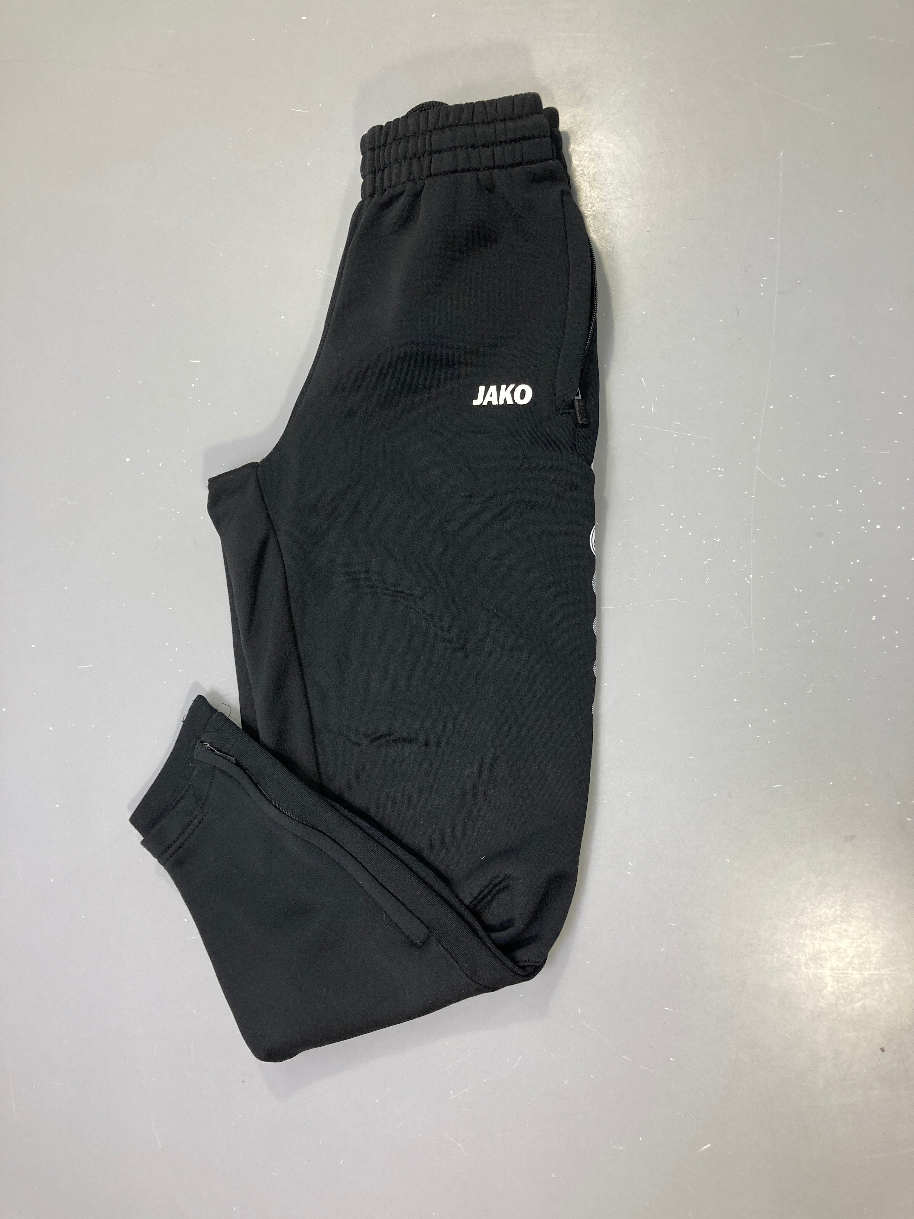 Pantalon de survêtement noir, poches zippées