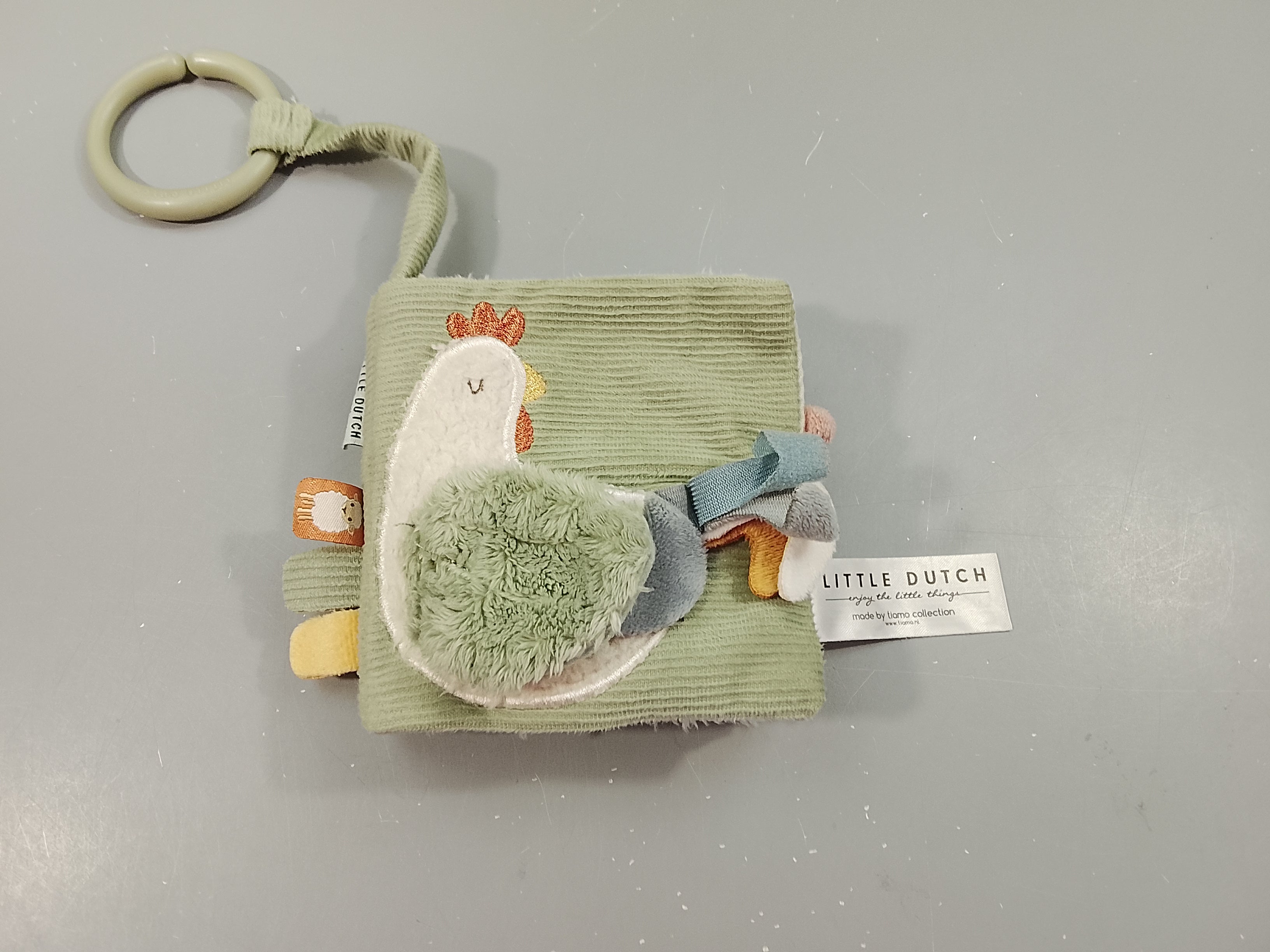 Livre d'activités en tissus  vert, poule en relief Little  Dutch