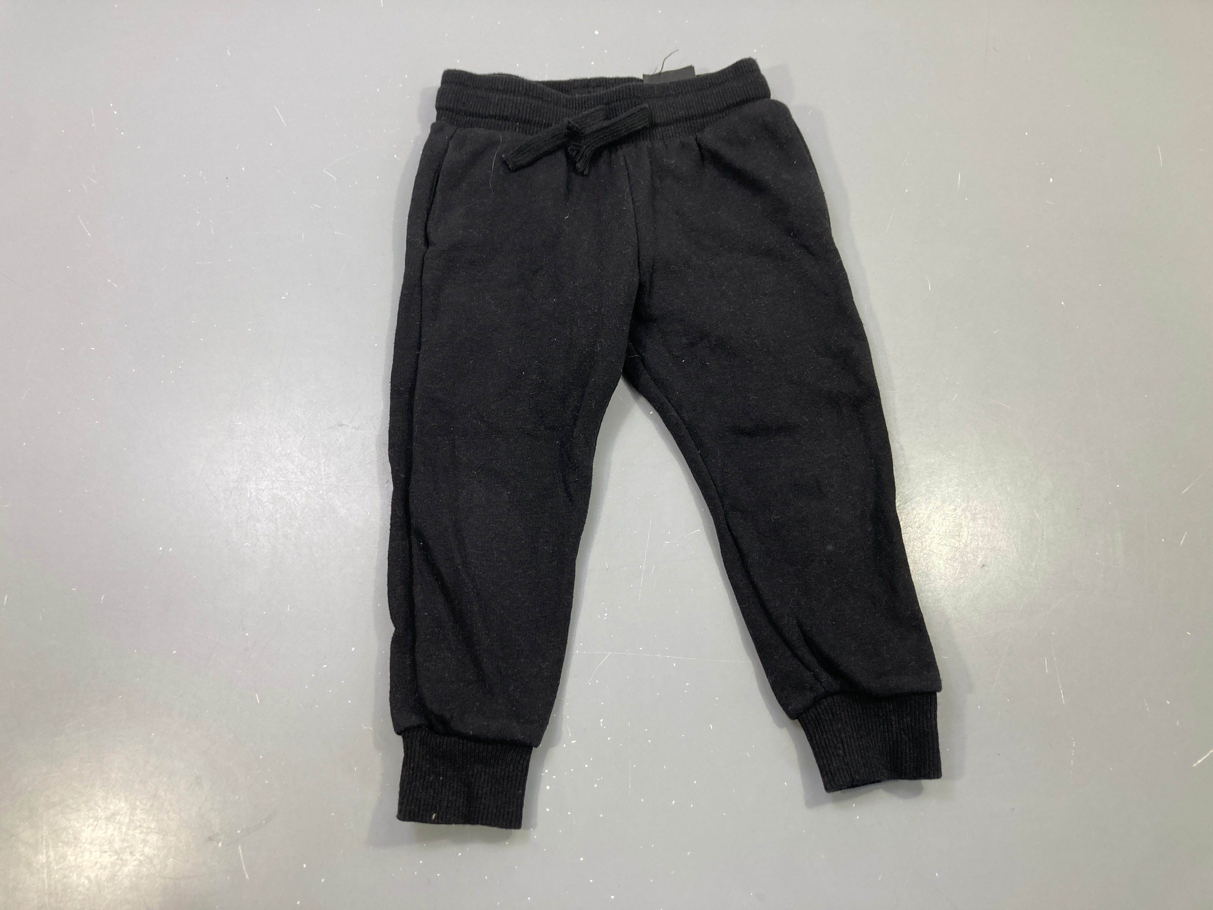 Pantalon molleton noir uni, cordon, bas côtelés