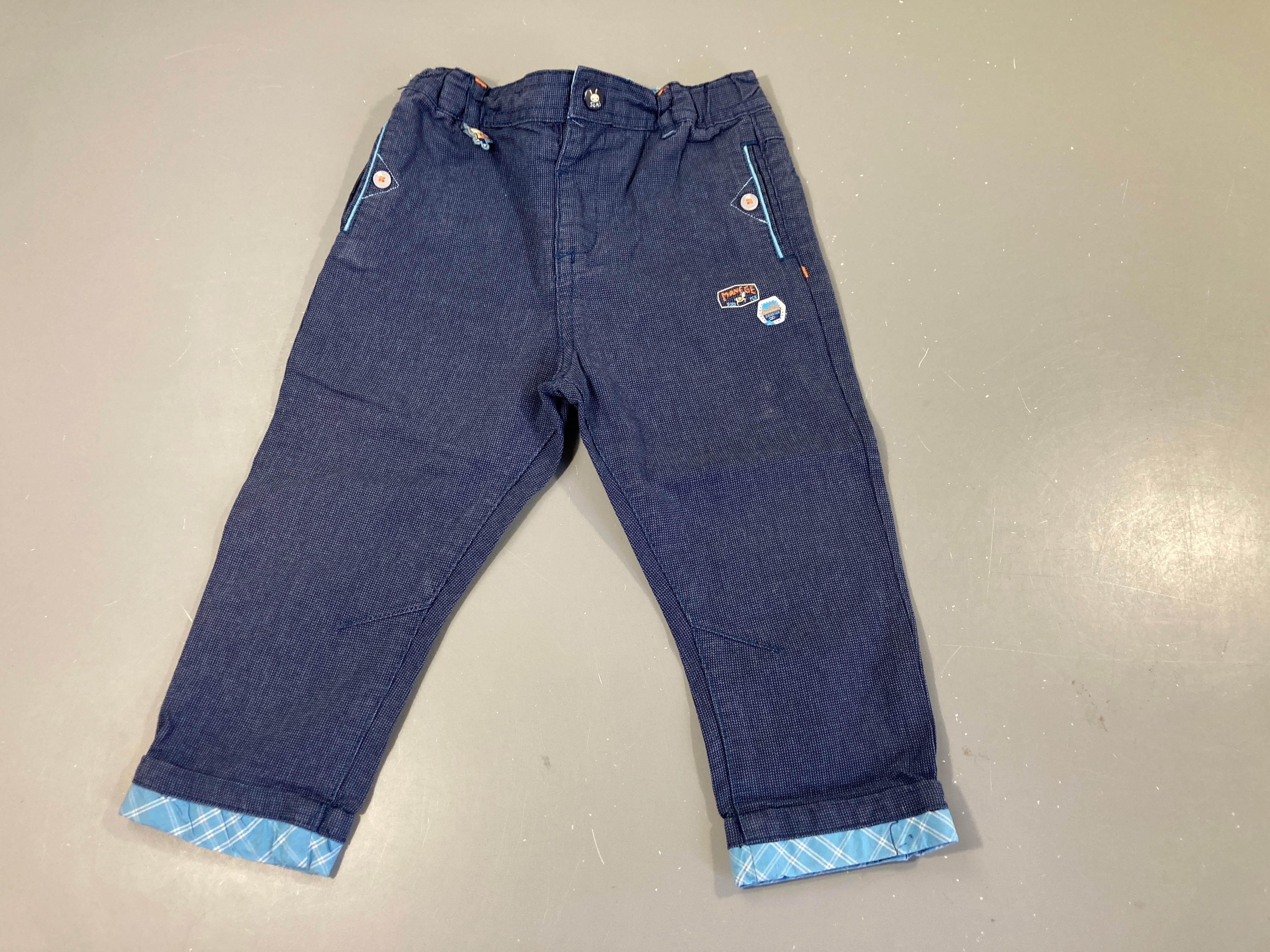 Pantalon bleu chiné à revers lapin