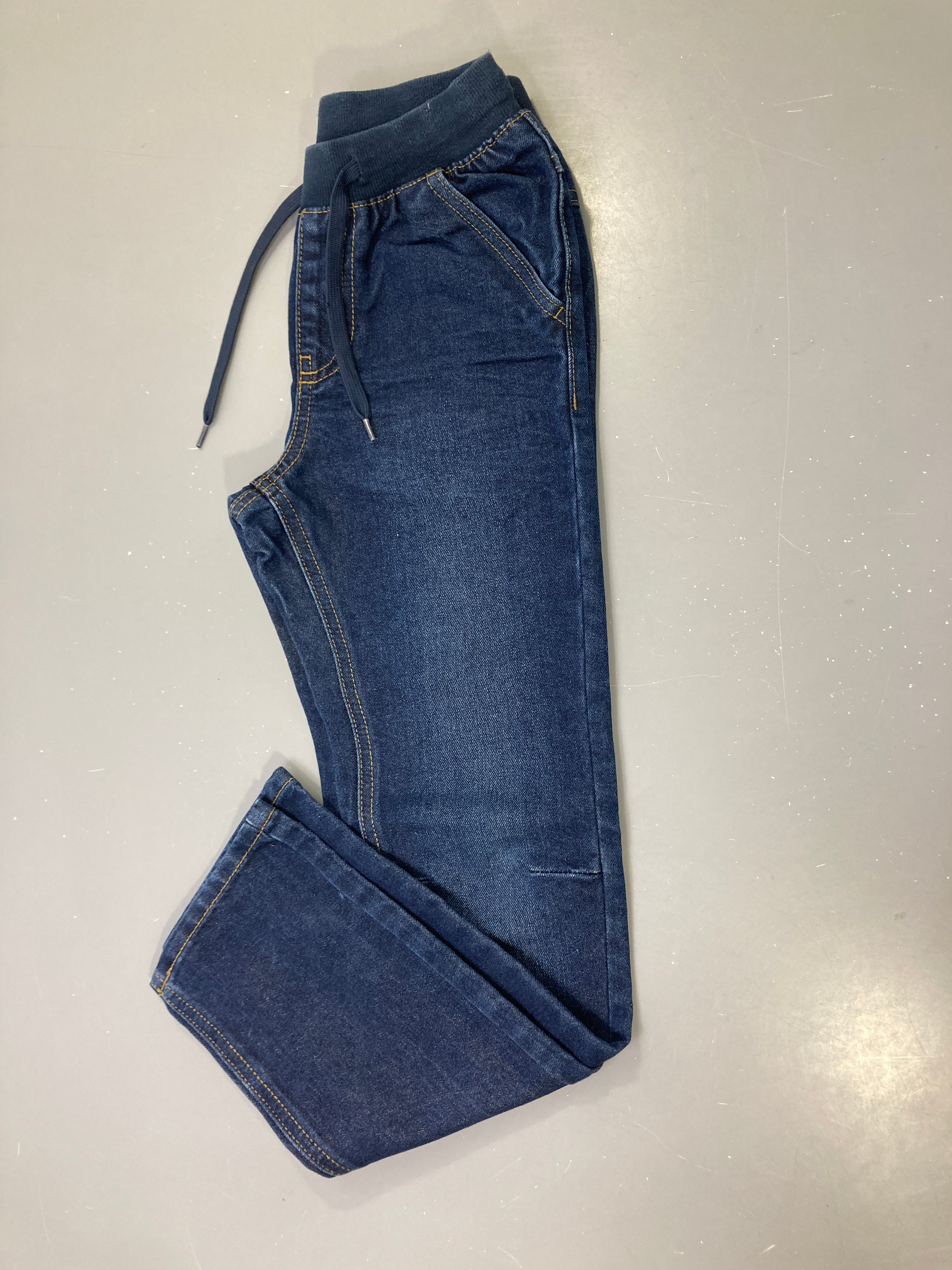 Pantalon jean bleu brut taille élastique côtelée cordon