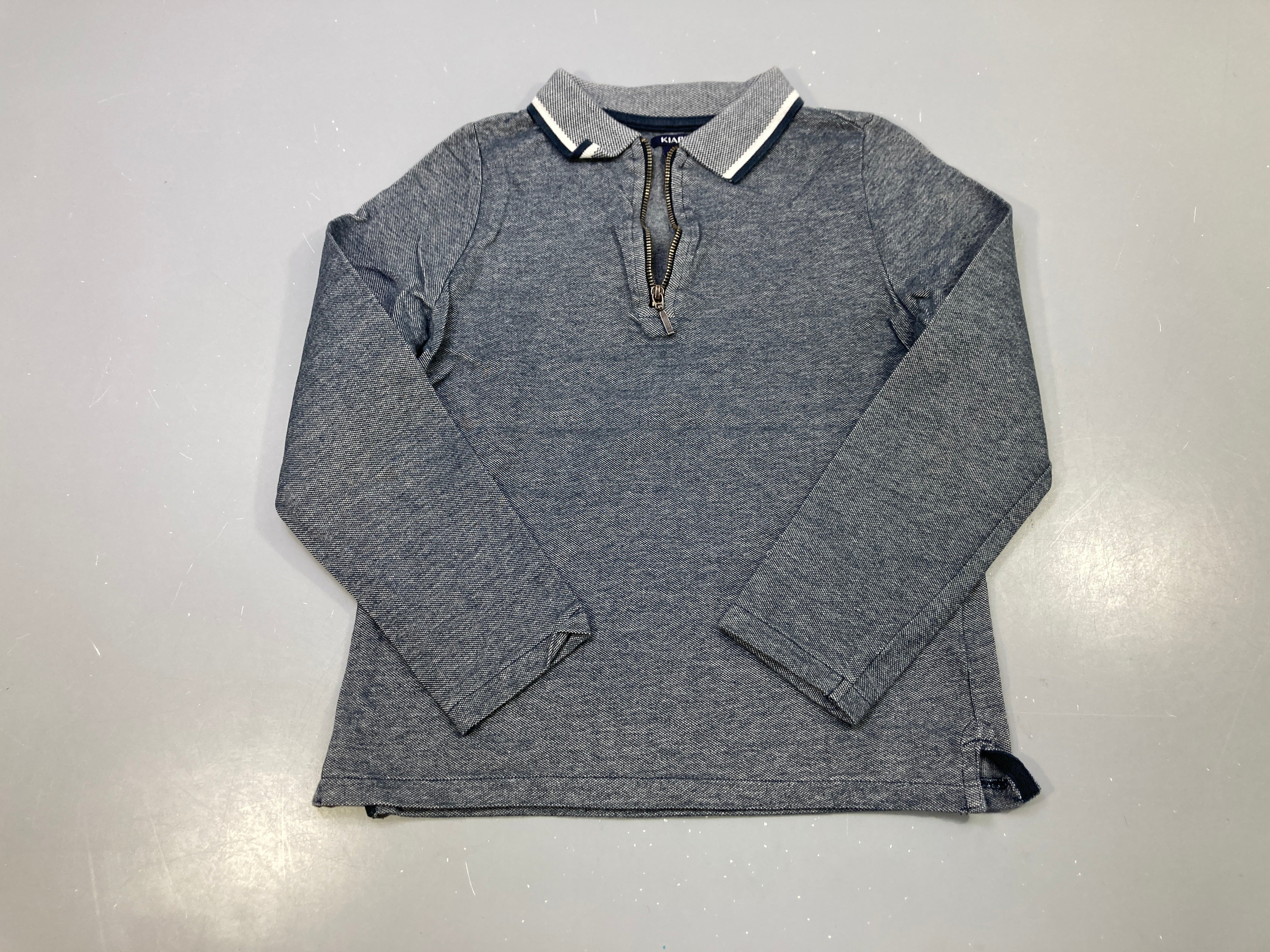 Polo m.l bleu marine chiné, col zippé liseré blanc