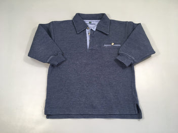 Polo m.l épais bleu foncé chiné, légèrement bouloché autour poche