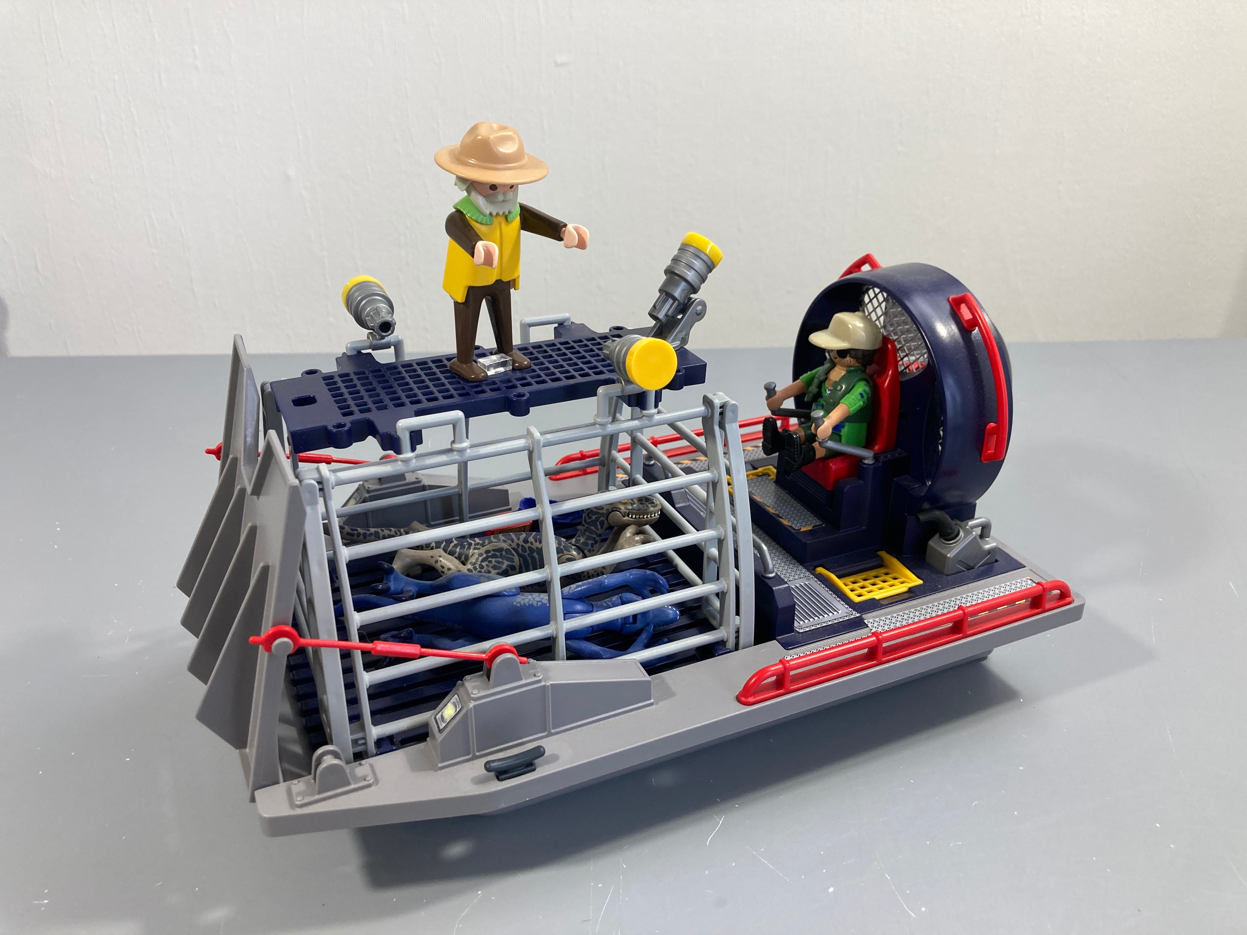 Playmobil 9433 The Explorers : Bateau avec cage et Déinonychu Vendu tel que sur la photo (manque la corde et crochet)