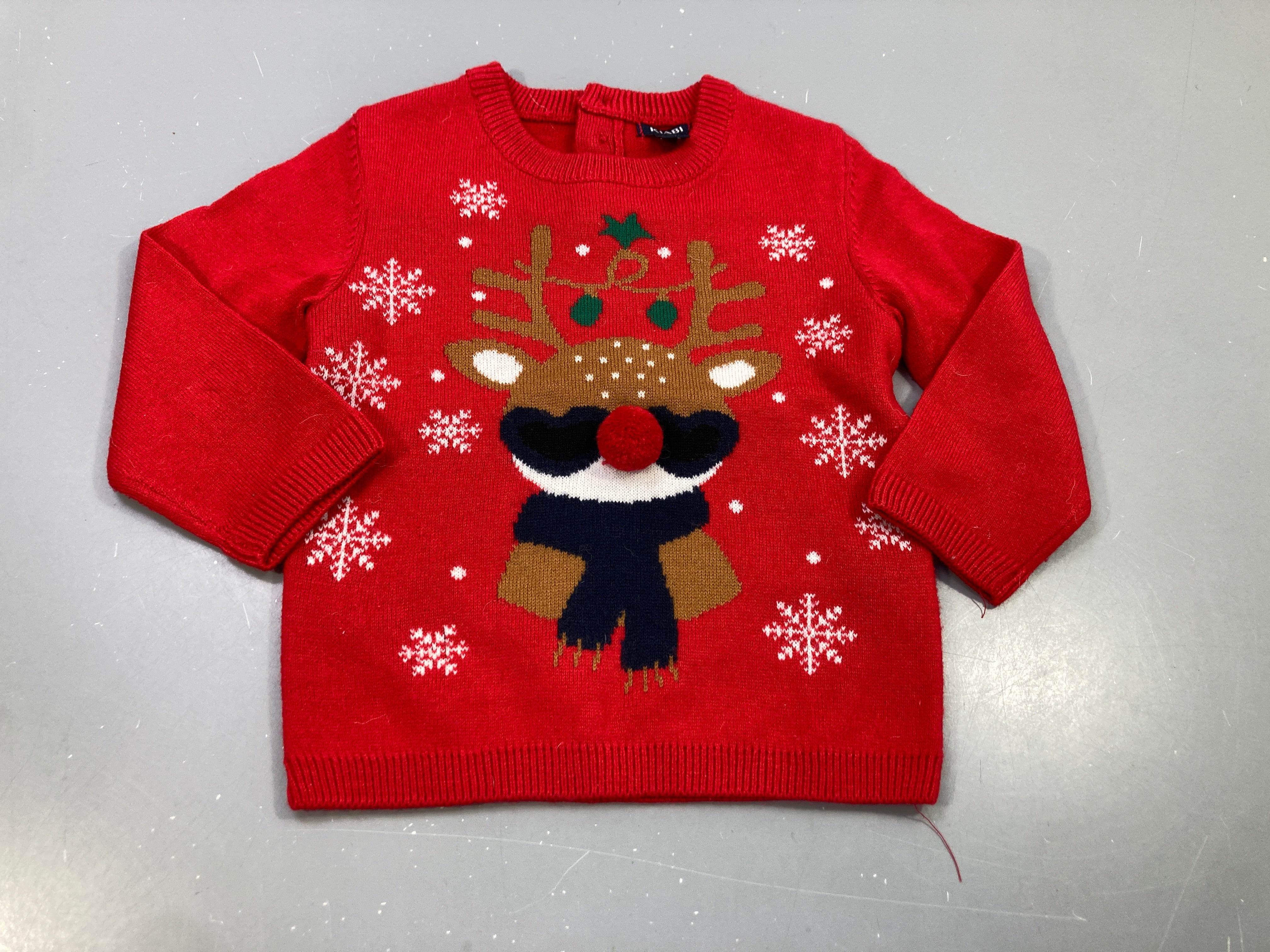 Pull rouge de noël , tête de renne avec nez pompon rouge