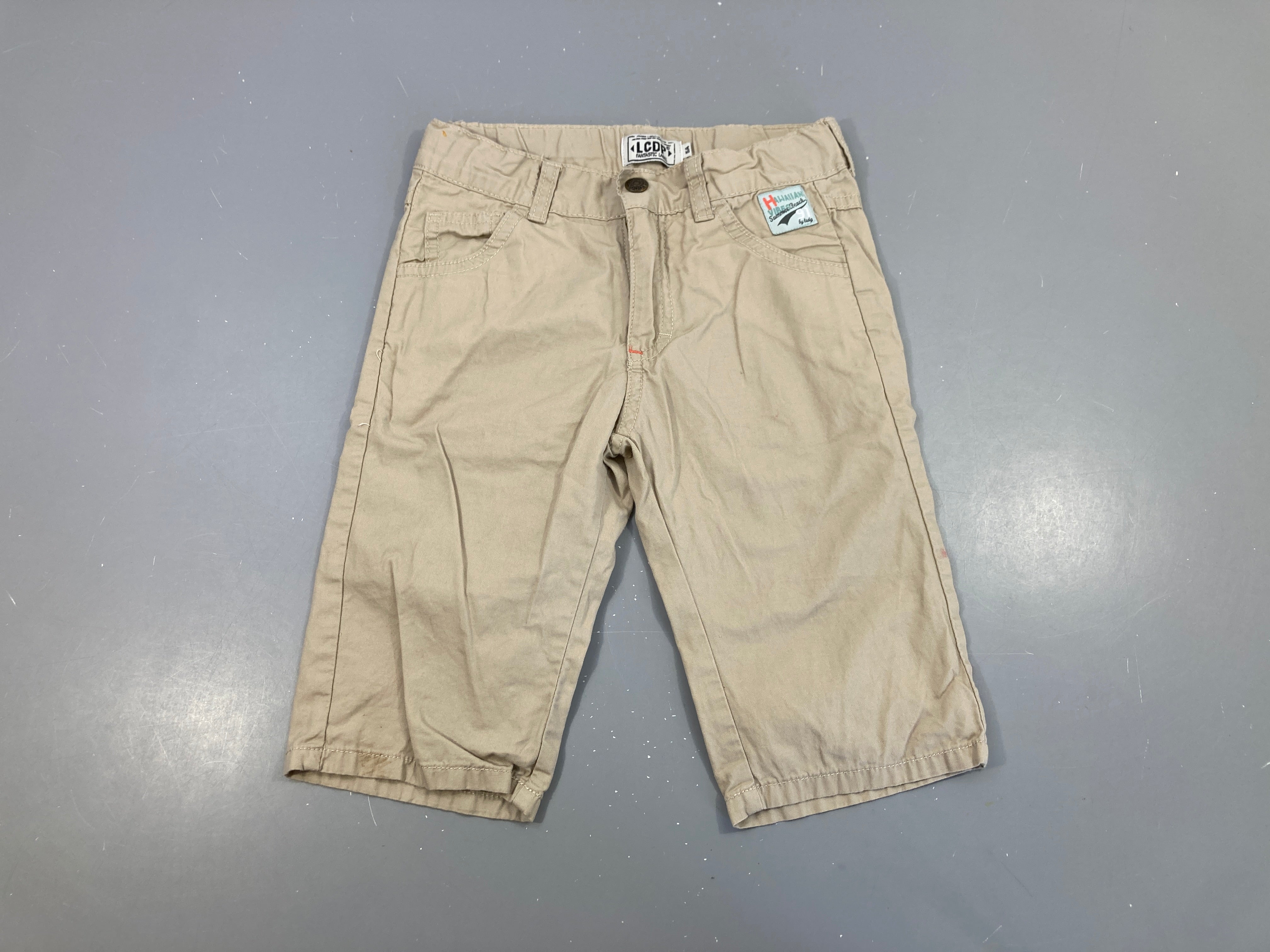 Bermuda beige tache bas jambe D