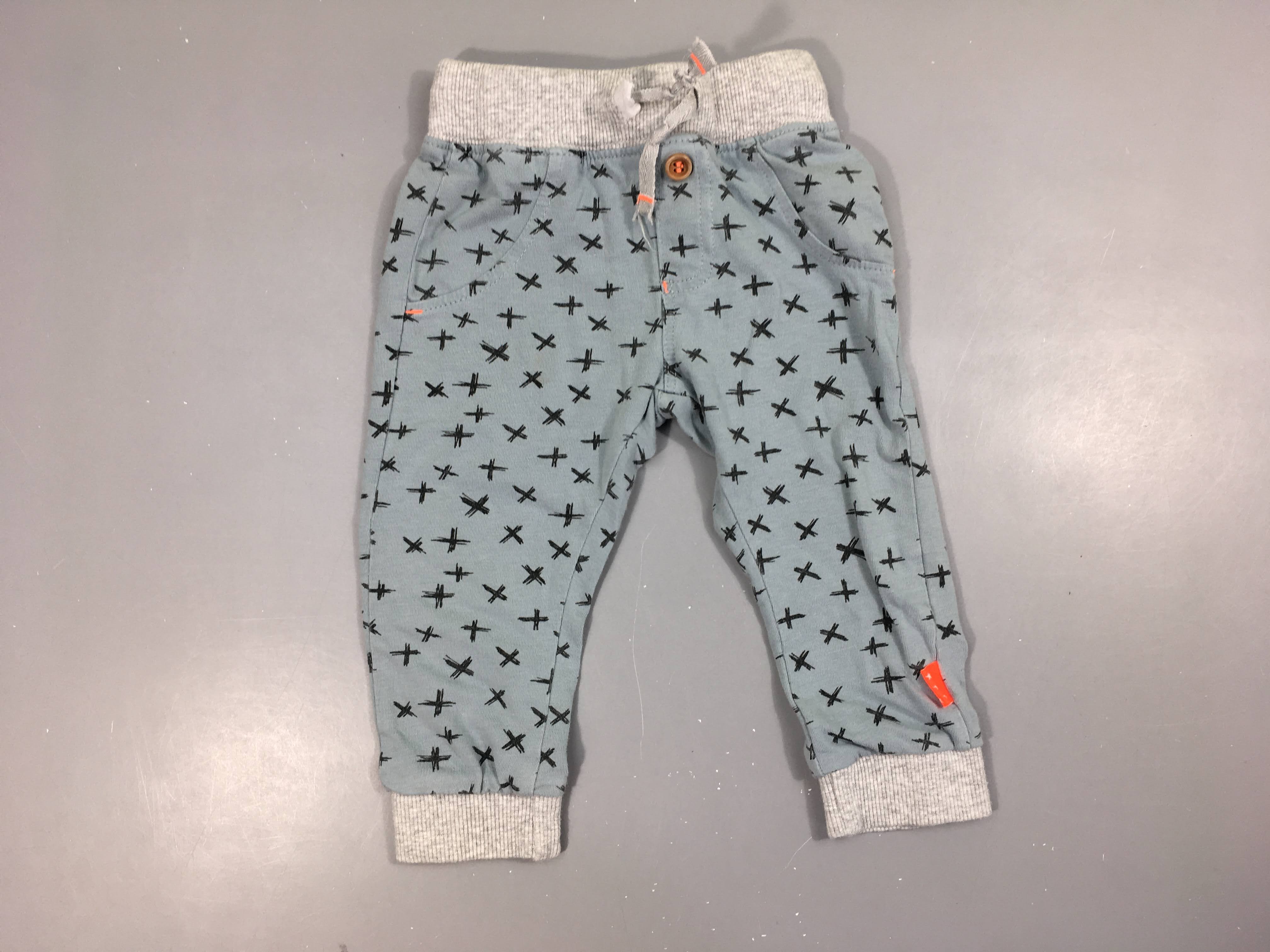 Pantalon jersey bleu motifs x taille et chevilles élastiques