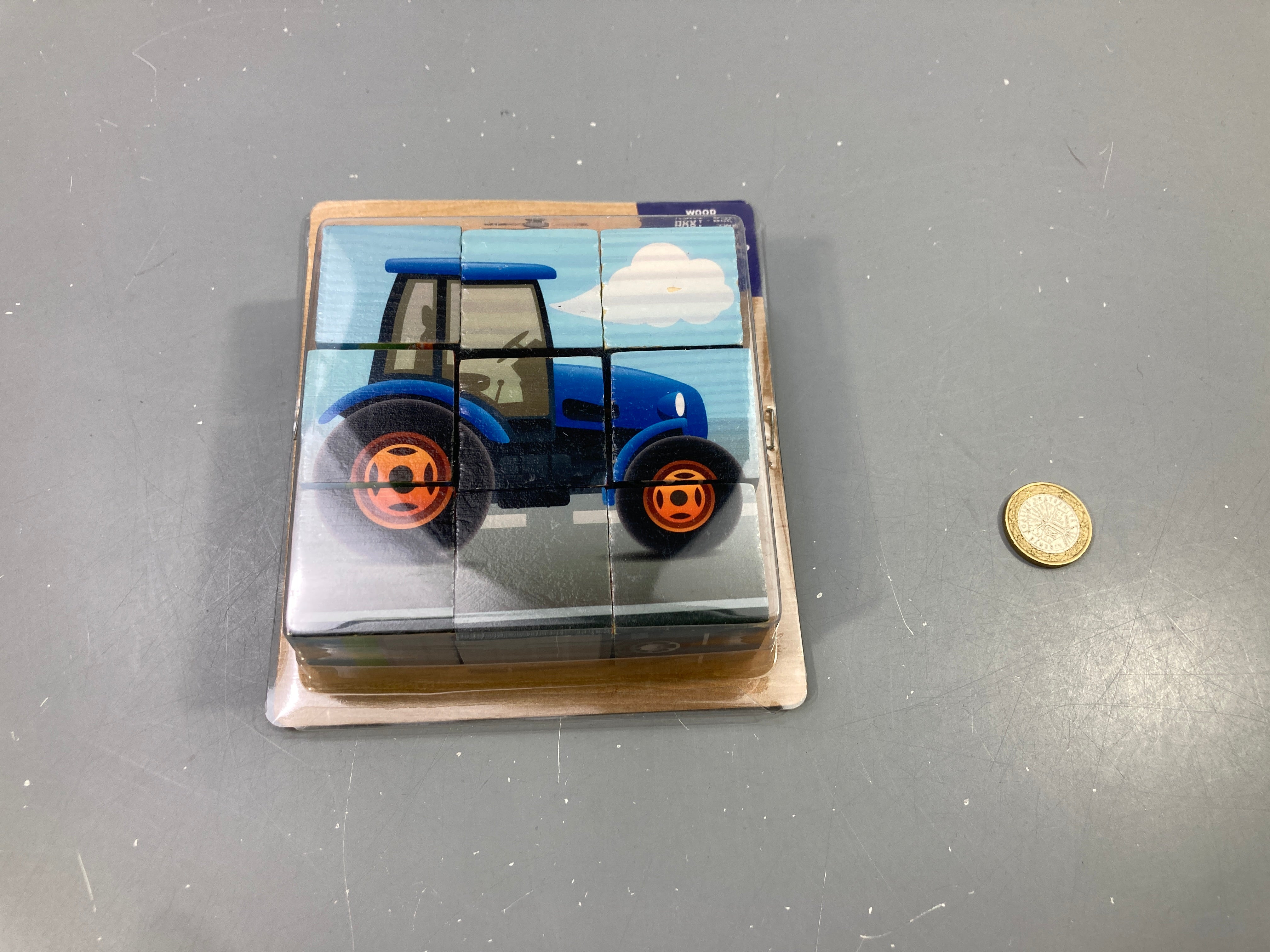 Puzzle 9 cubes en bois véhicules, tracteur bleu, sous blister (Action)