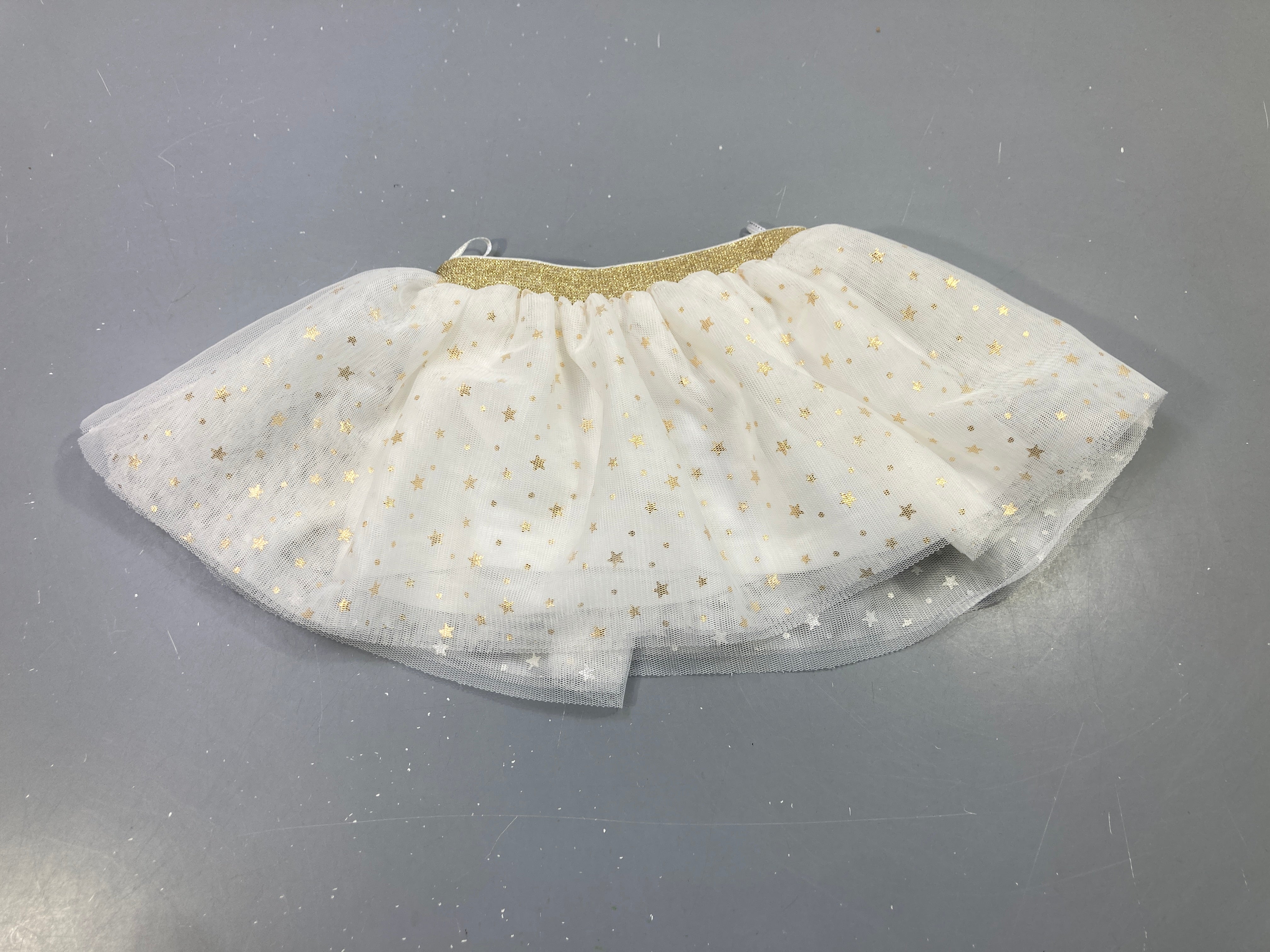 Jupe en tulle blanc ,étoiles dorées, doublé jersey , taille élastique dorée