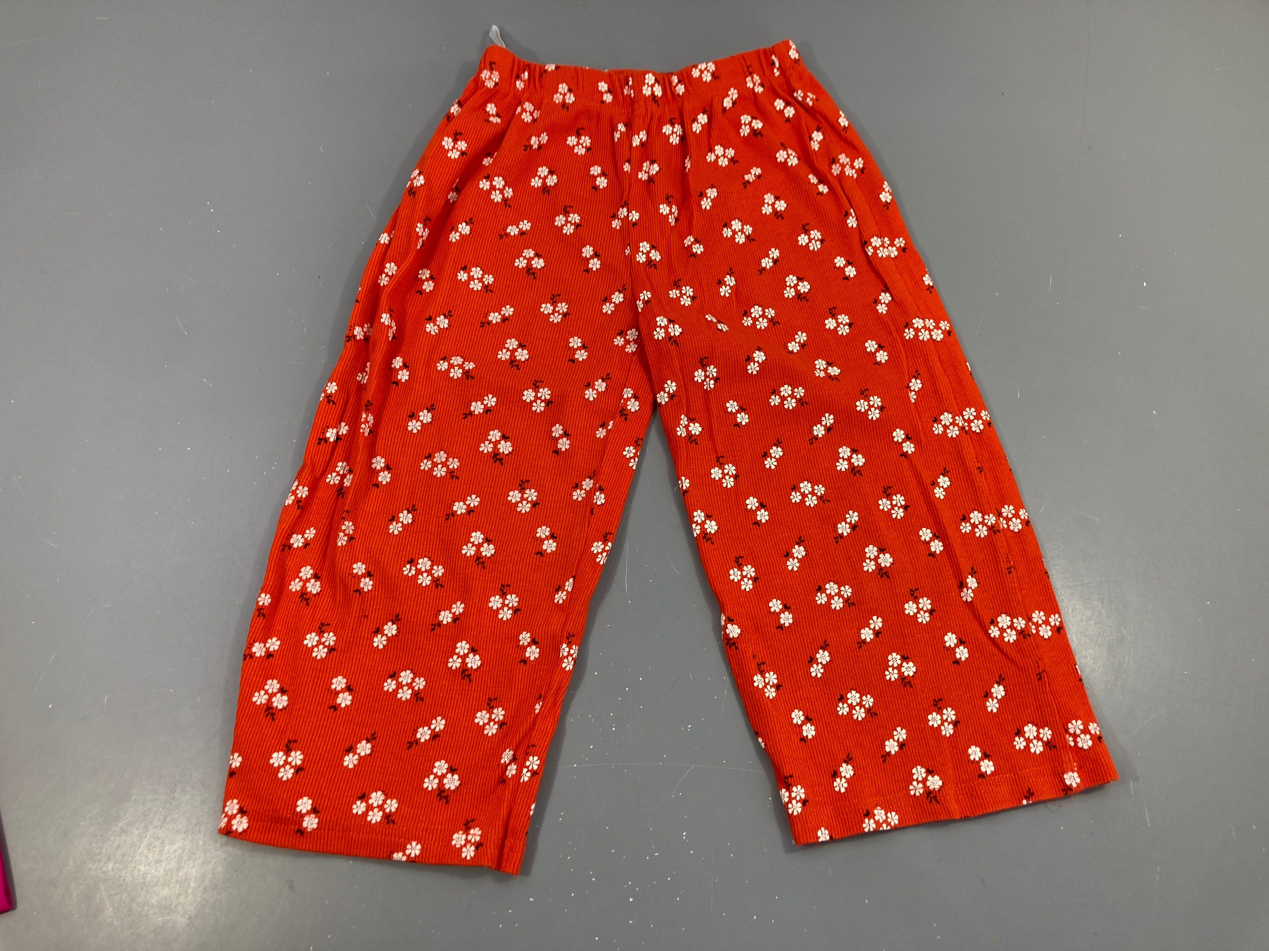 Pantalon molleton orange fleurs blanc