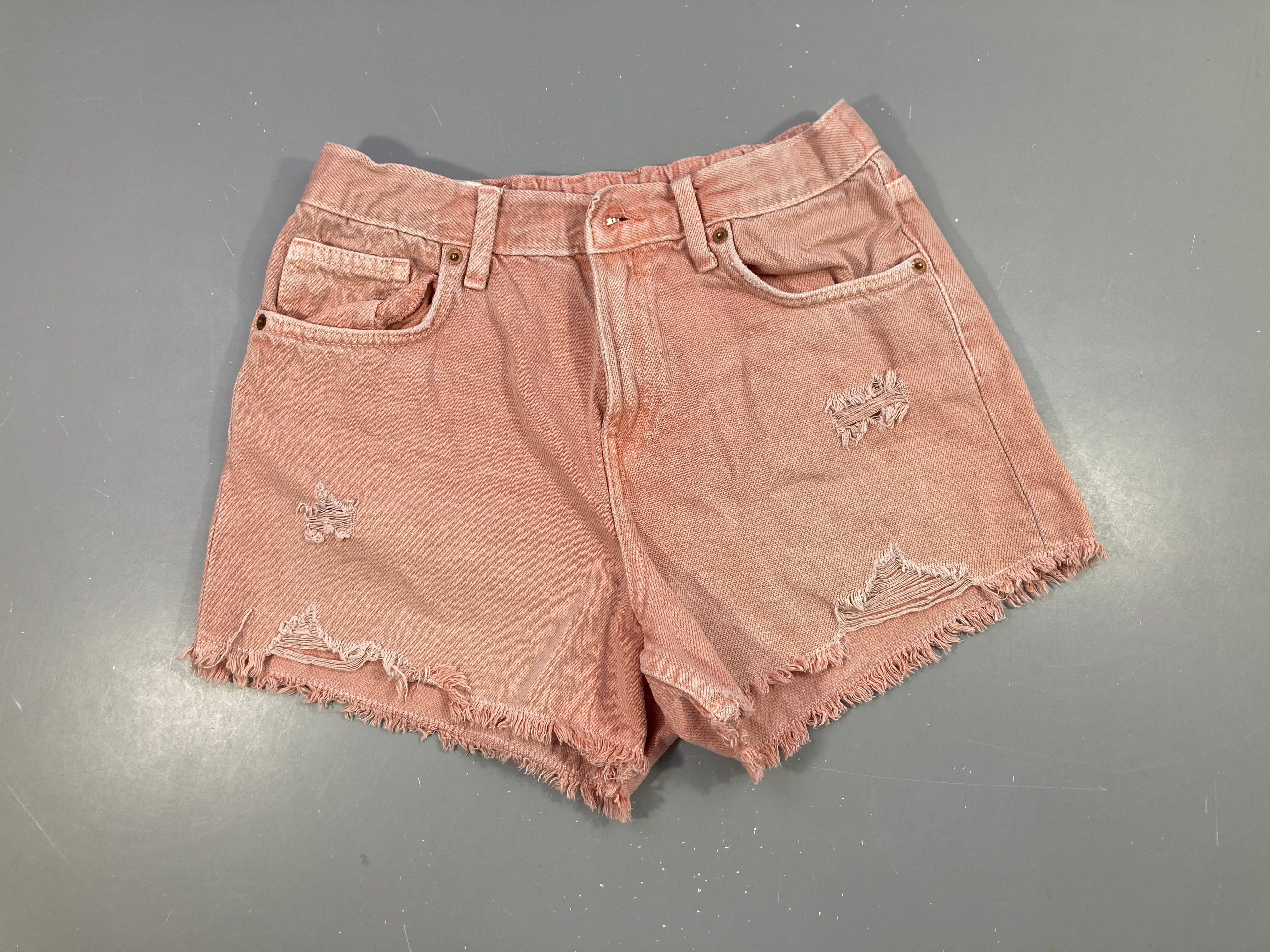 Short en jean rose clair effet déchiré