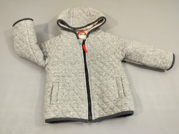 Gilet veste zippé à capuche gris  matelassé. Intérieur moutonné.