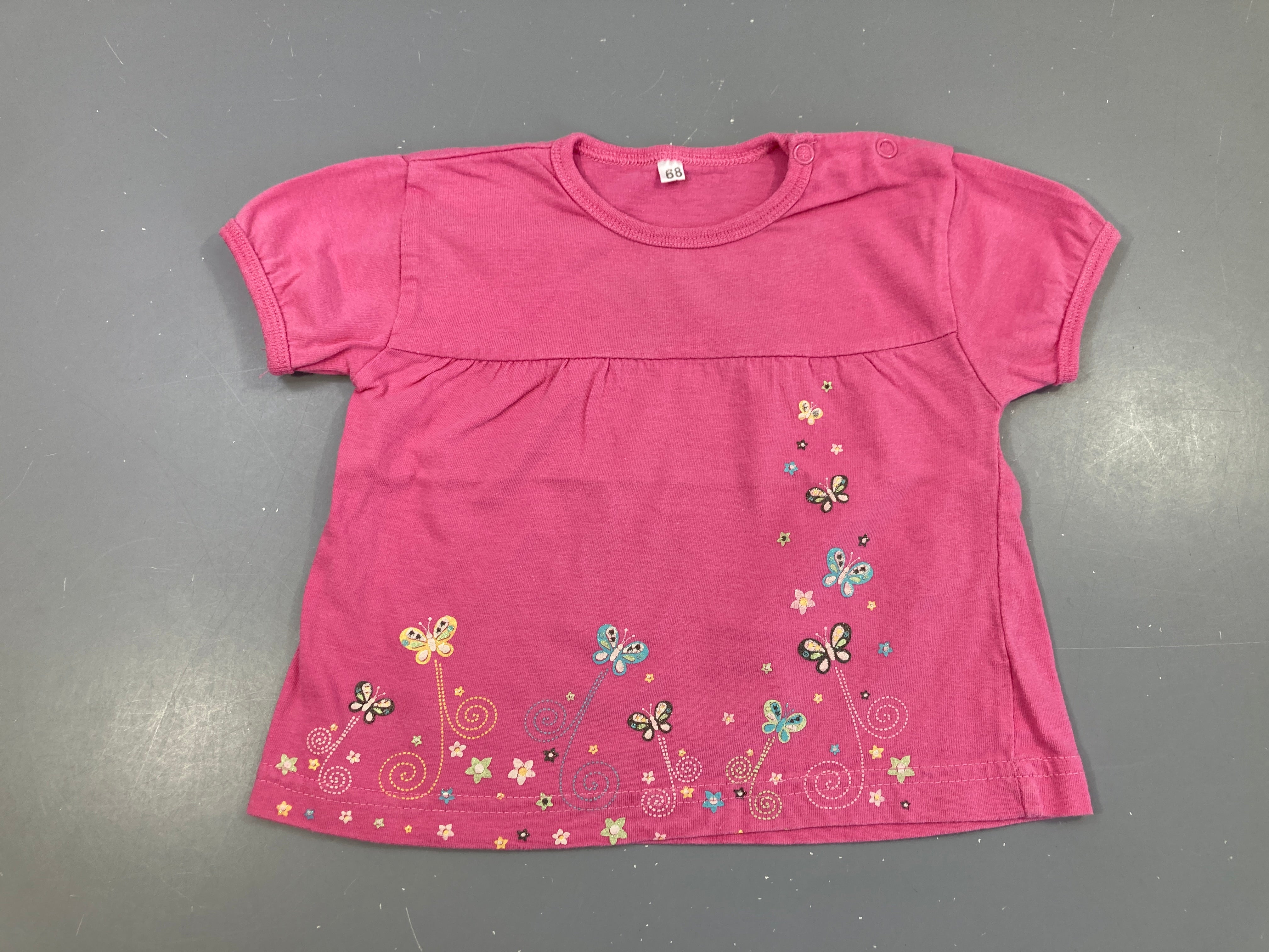 T-shirt m.c rose papillons légèrement bouloché