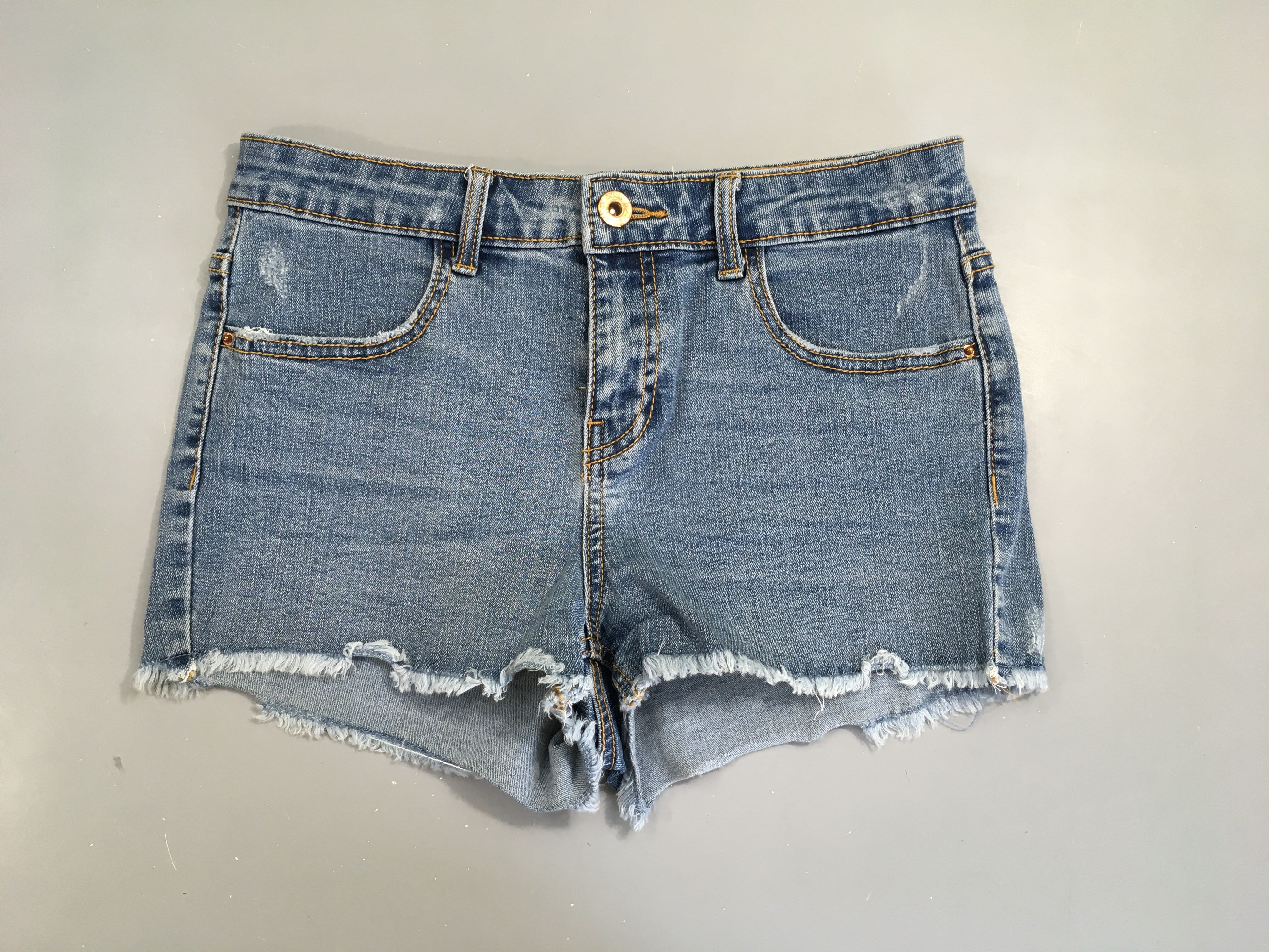 Short en jean effet effiloché 38