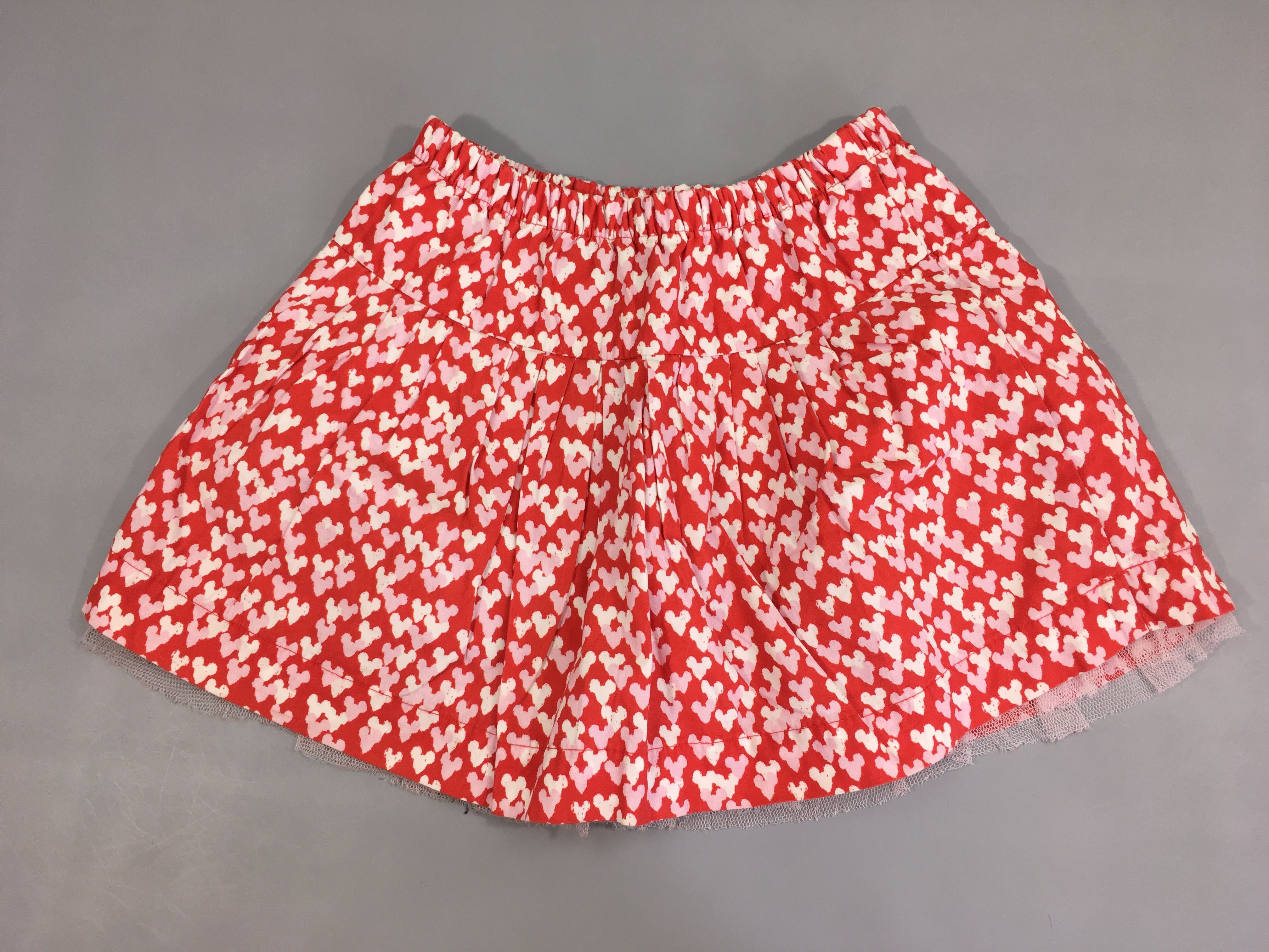 Jupe rouge motifs blanc/rose