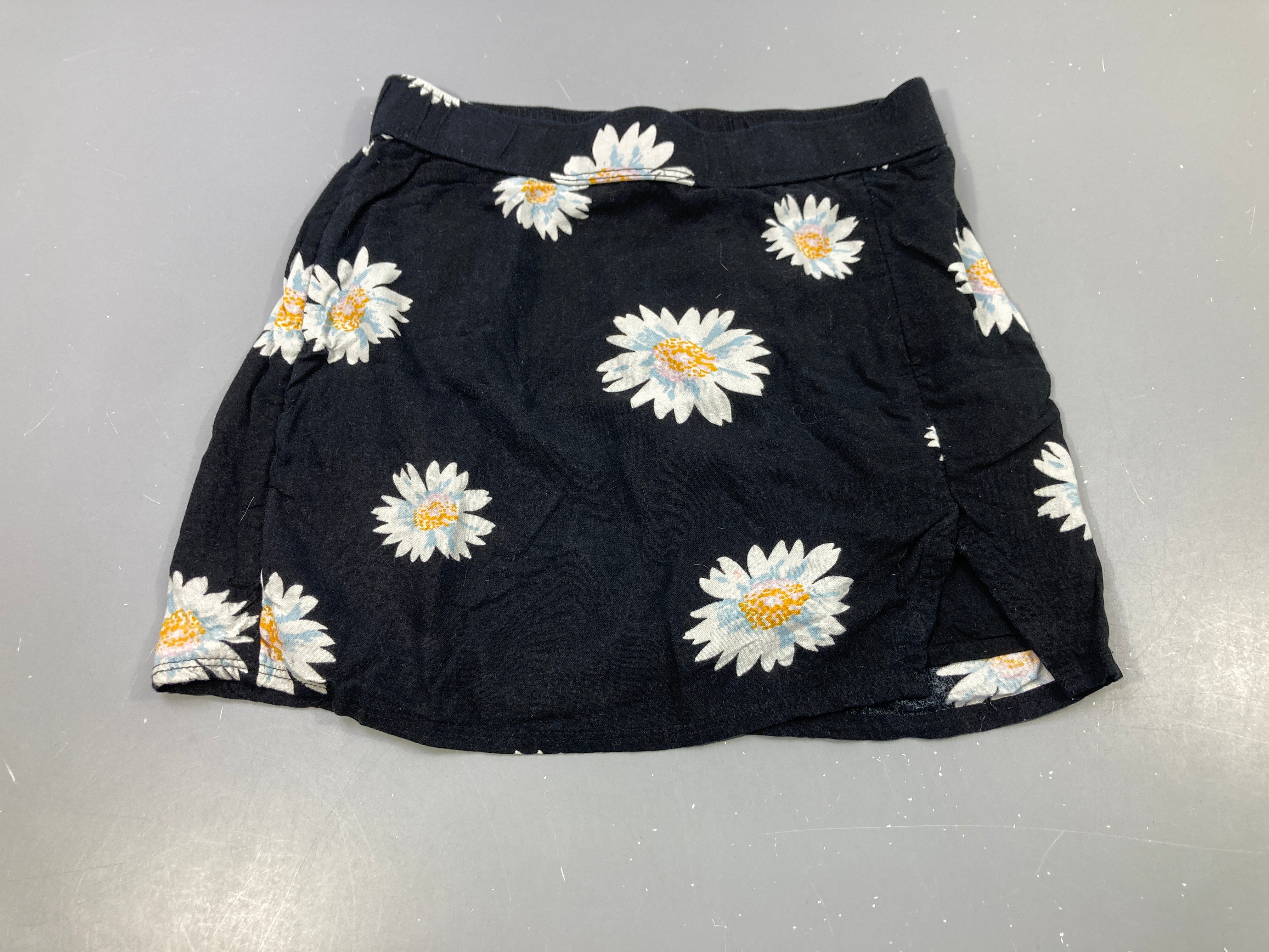 Jupe jersey noir, motifs marguerites
