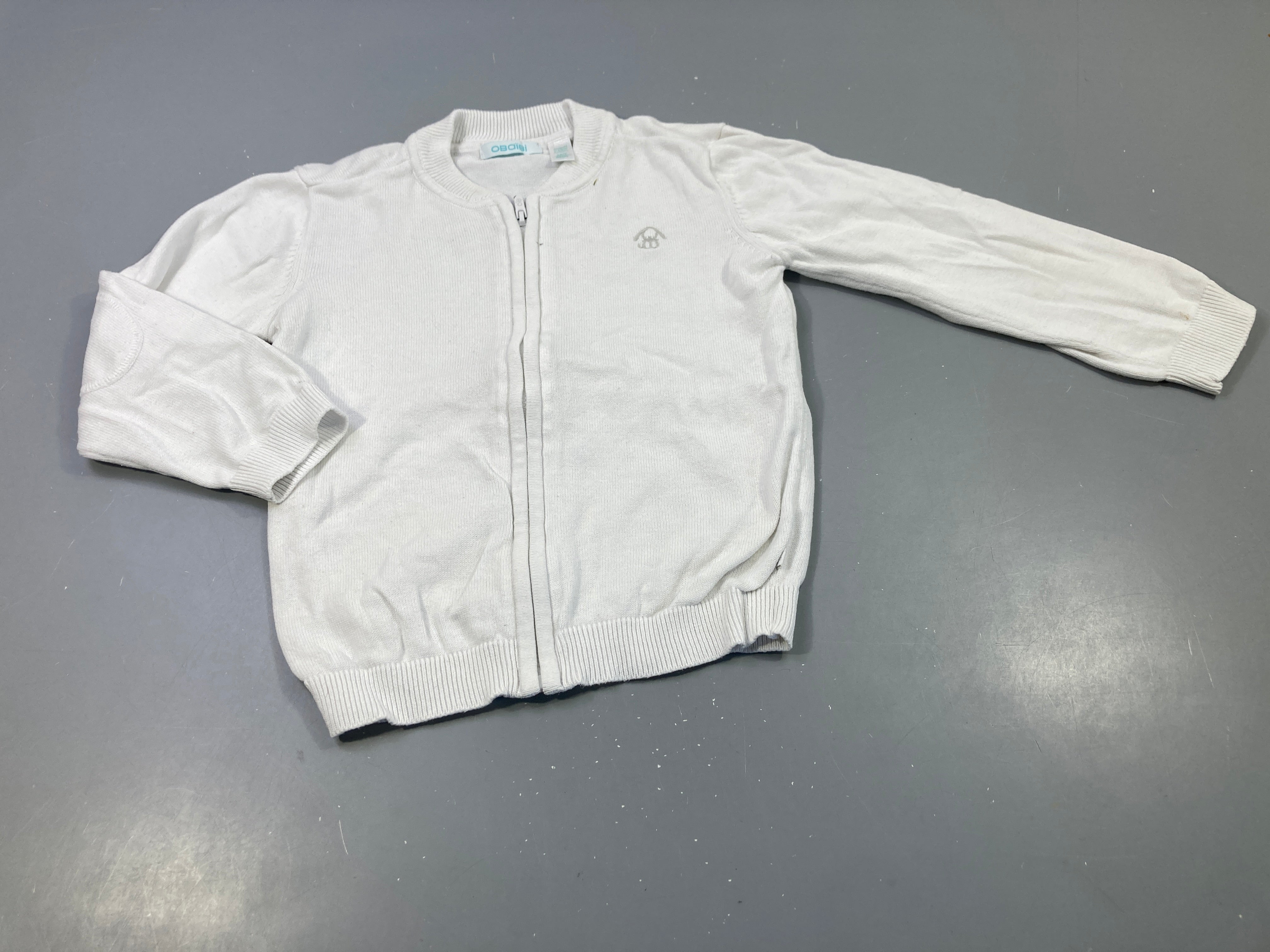 Gilet zippé blanc , petite tache noire
