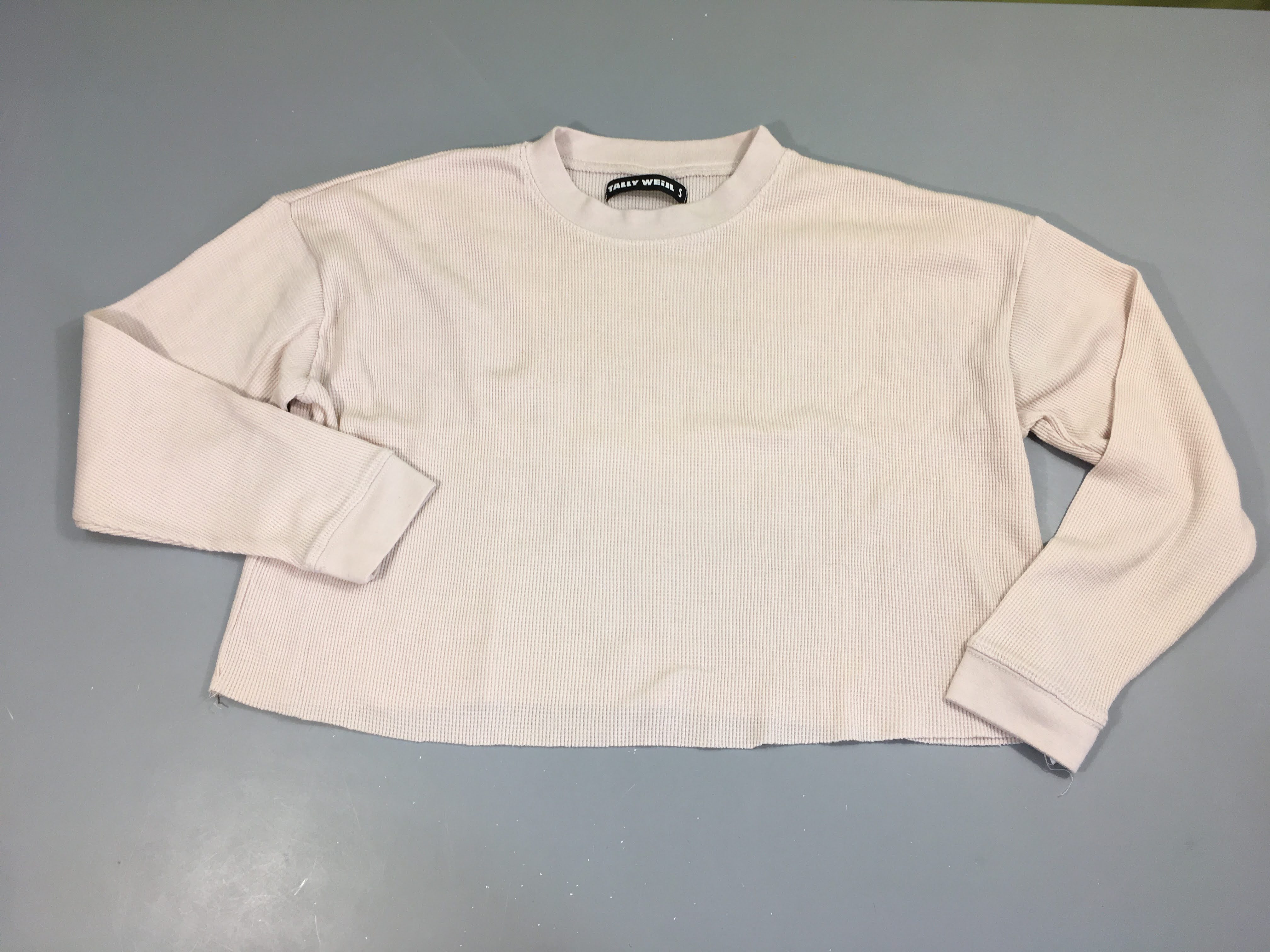 Sweat rose pâle tissu gaufré