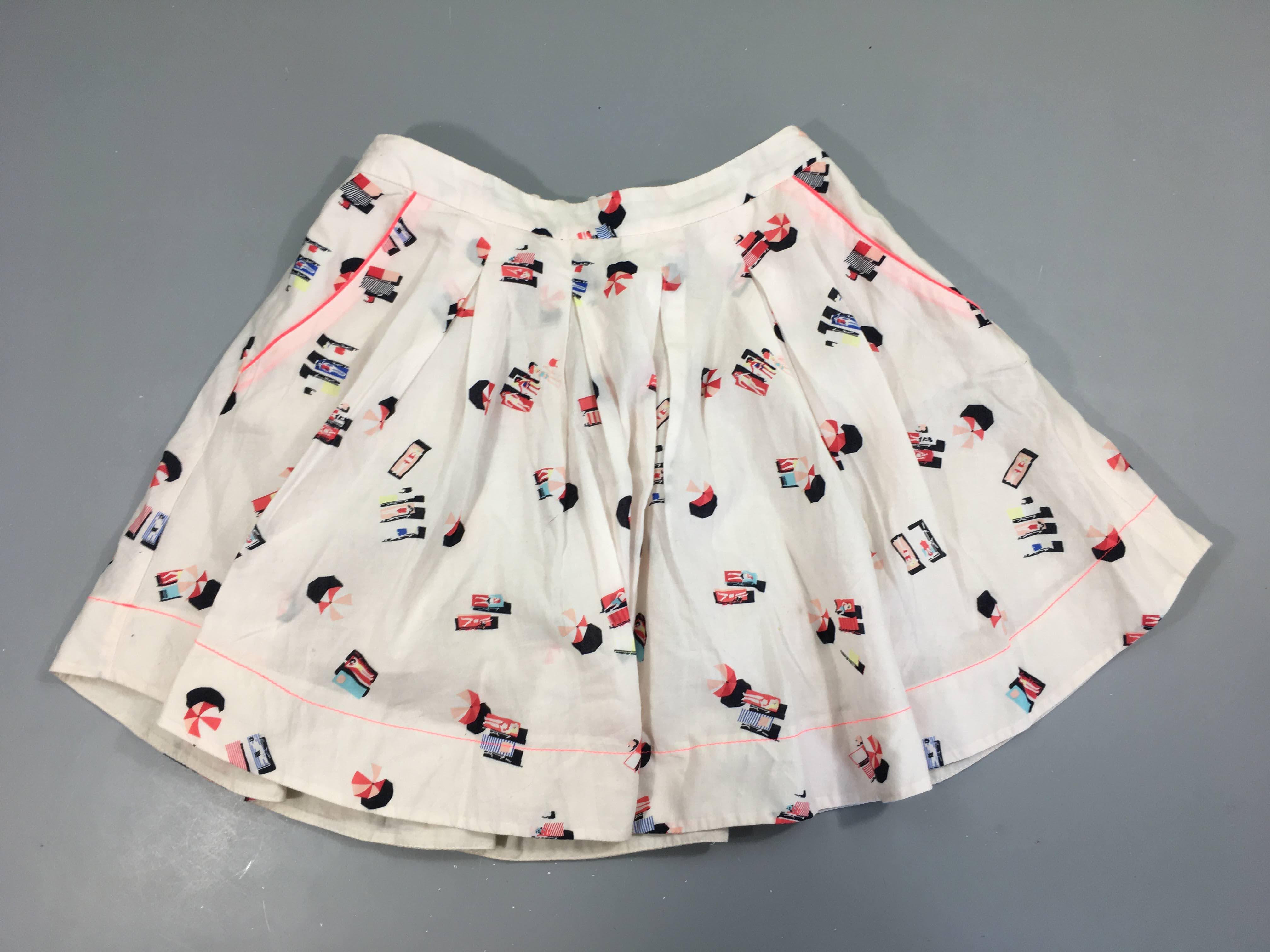 Jupe rose pâle motifs plage