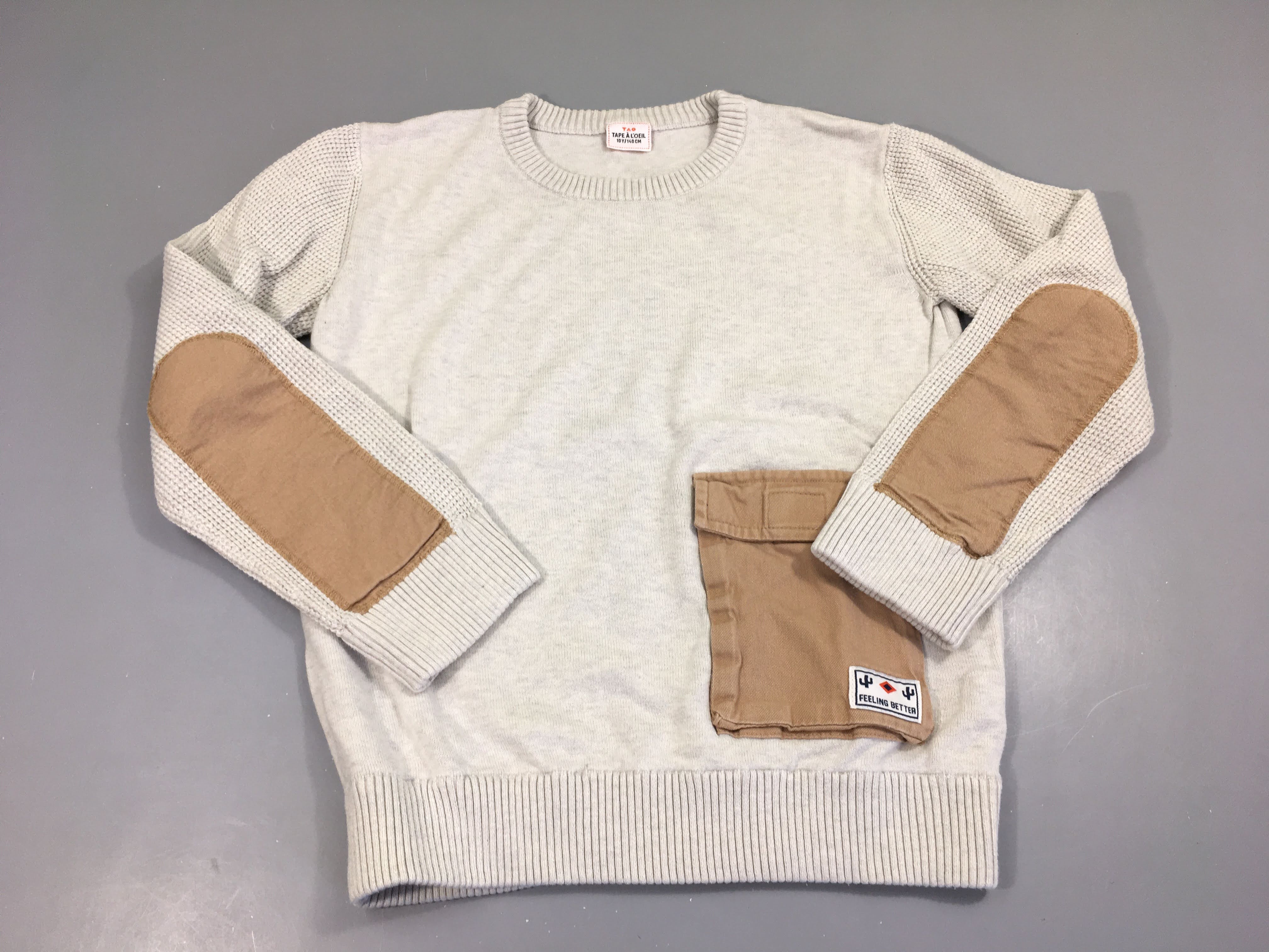 Pull gris très clair poche bas
