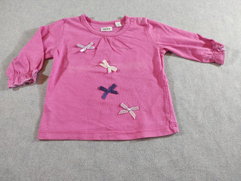 T-shirt m.l rose avec noeuds papillons (un peu décoloré )